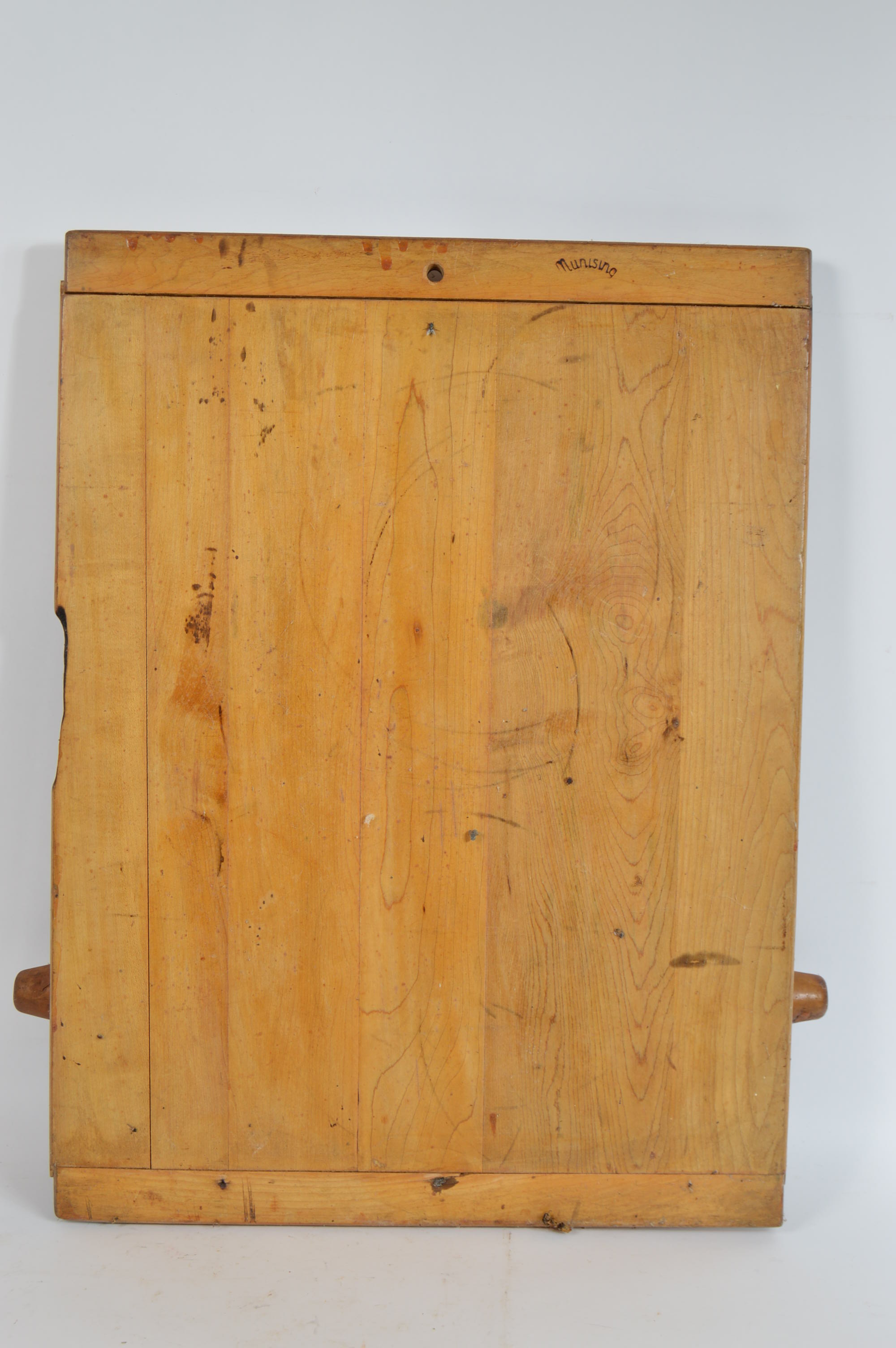 Collection of Speckled Enamel Ware Utensils Mounted on a Cutting Board