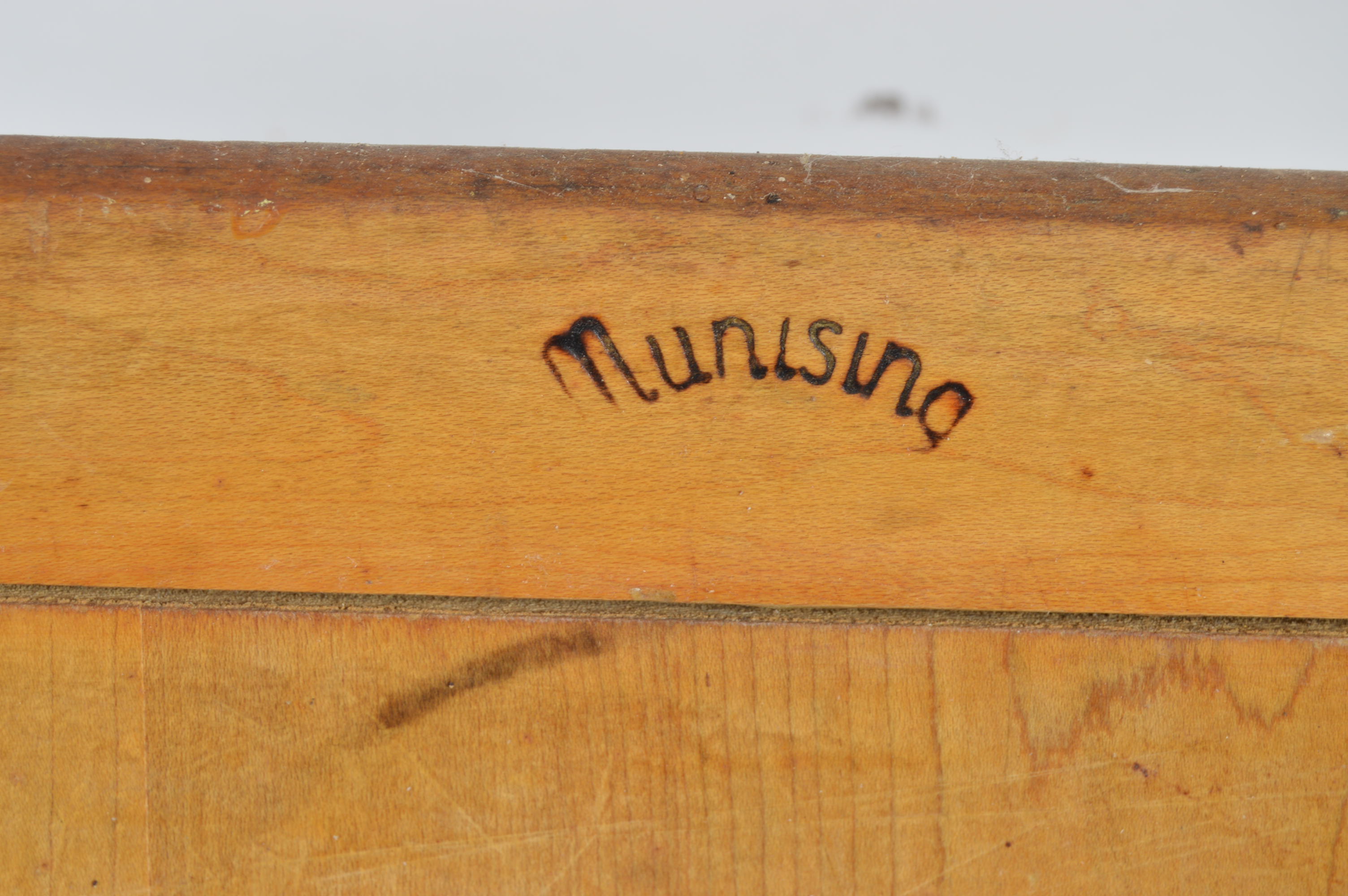 Collection of Speckled Enamel Ware Utensils Mounted on a Cutting Board