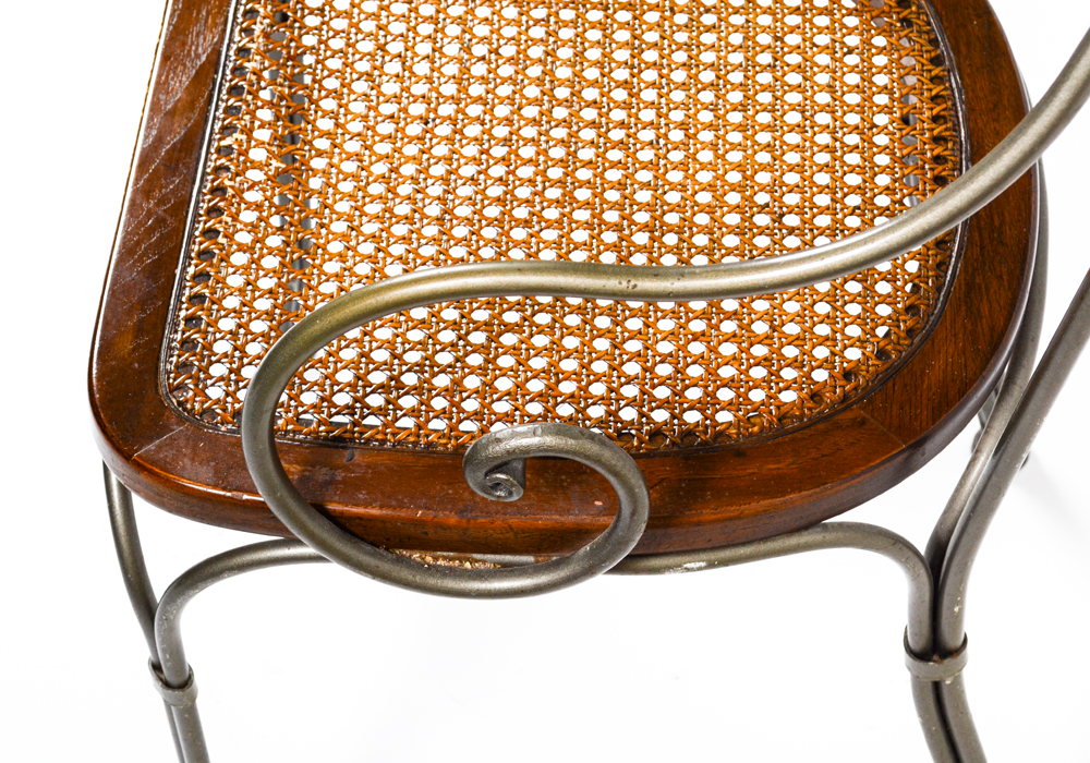 Four Caned Wrought Iron Chairs