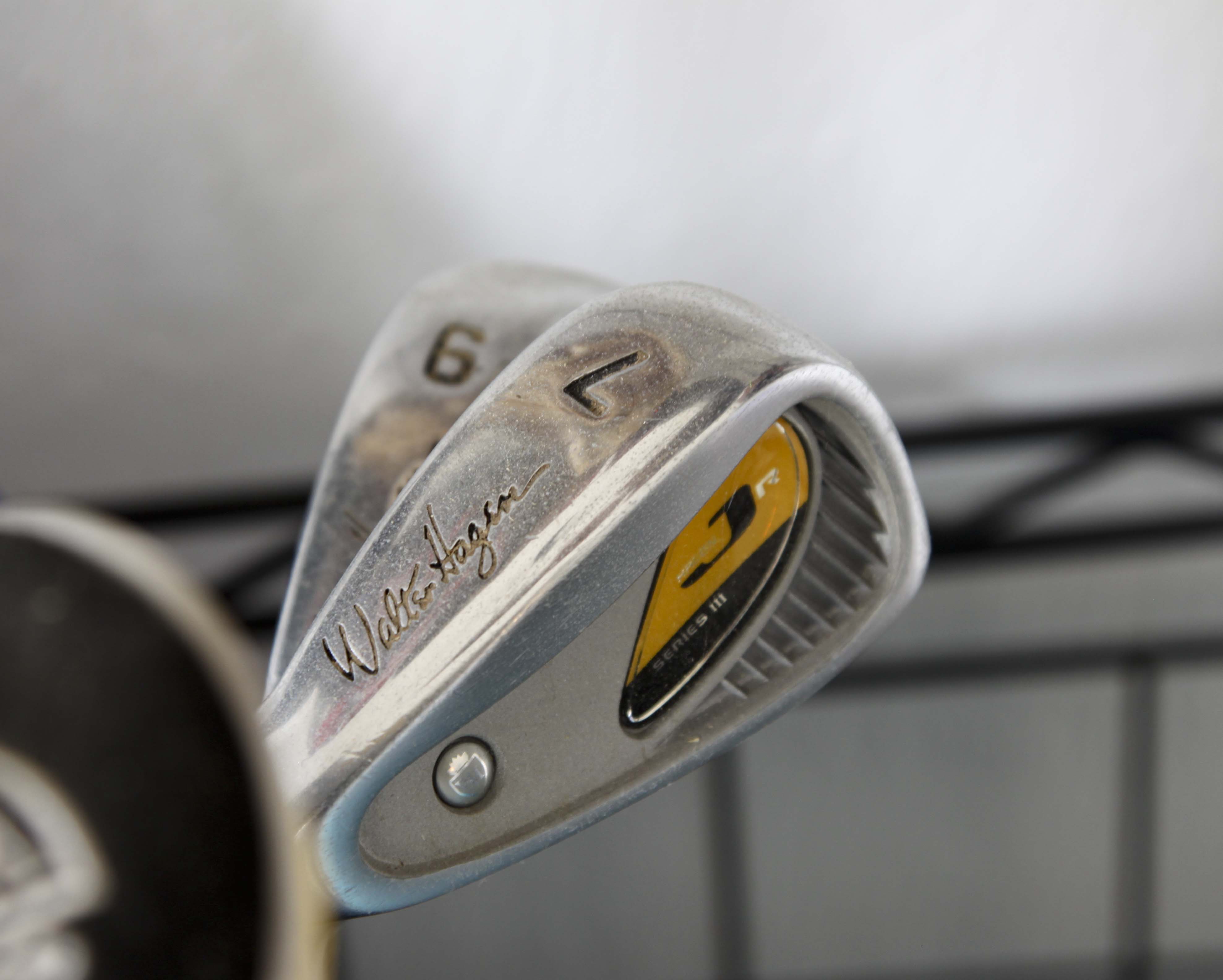 Golf Clubs and Sporting Goods with Storage Rack