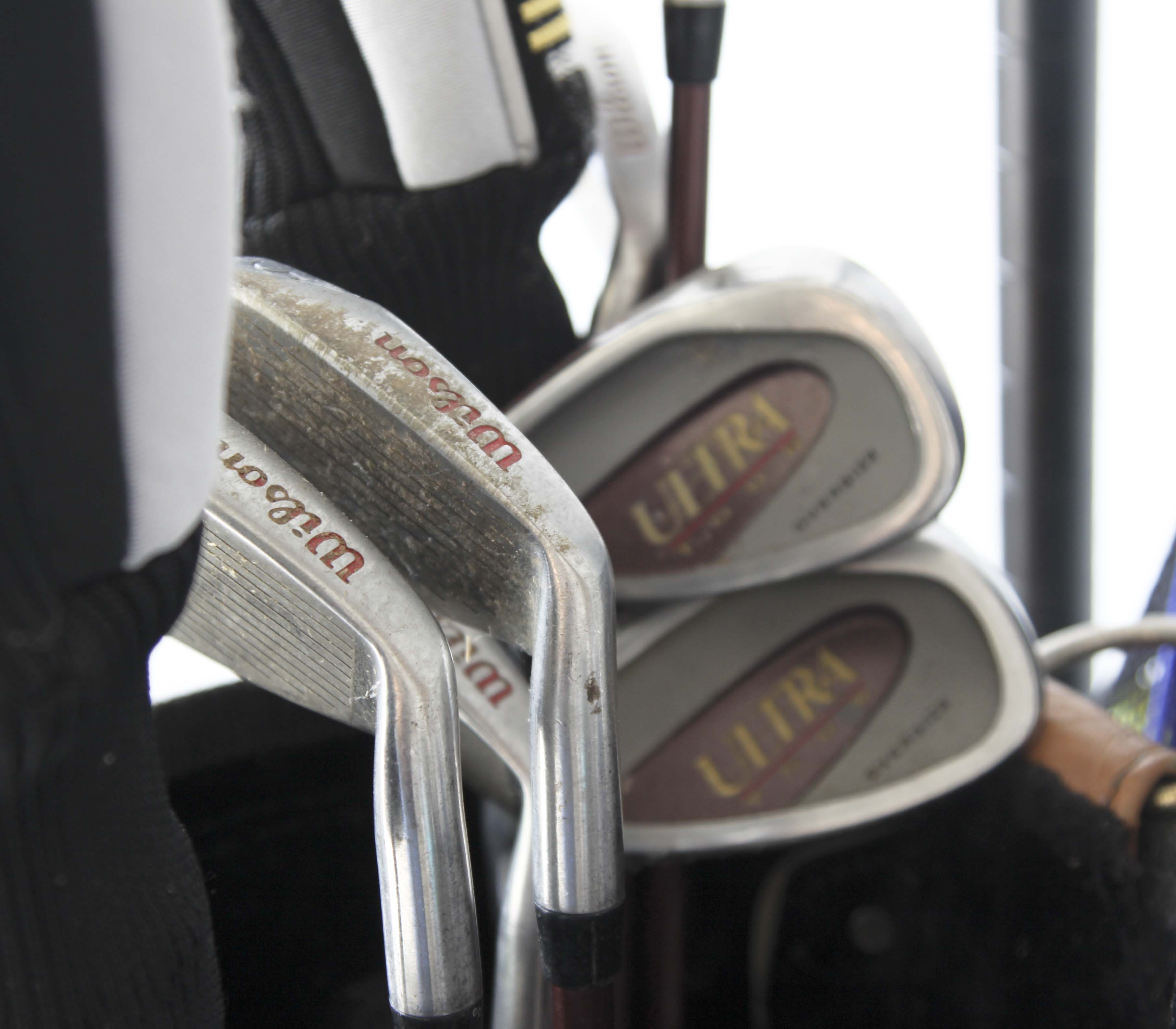 Golf Clubs and Sporting Goods with Storage Rack