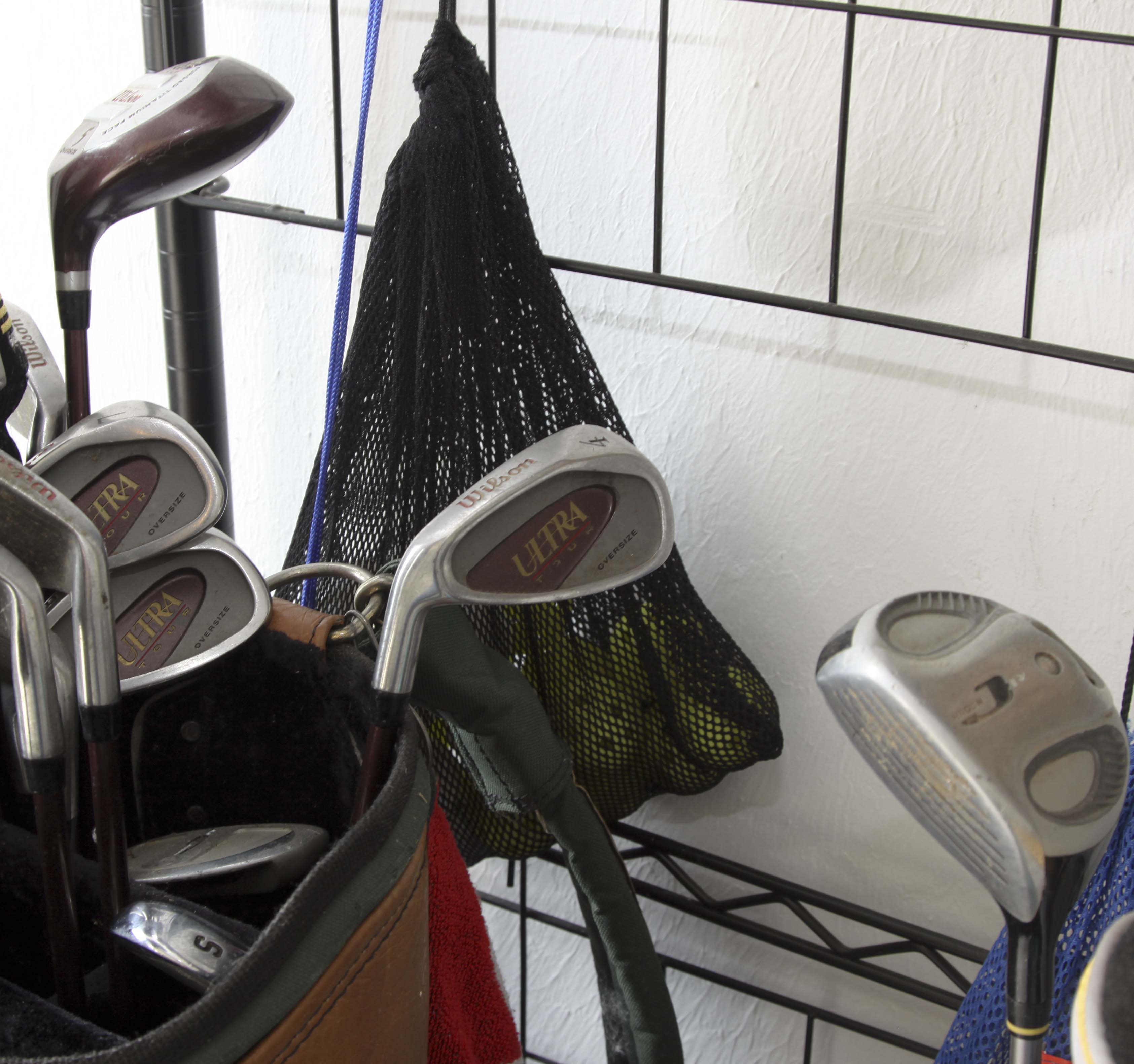 Golf Clubs and Sporting Goods with Storage Rack