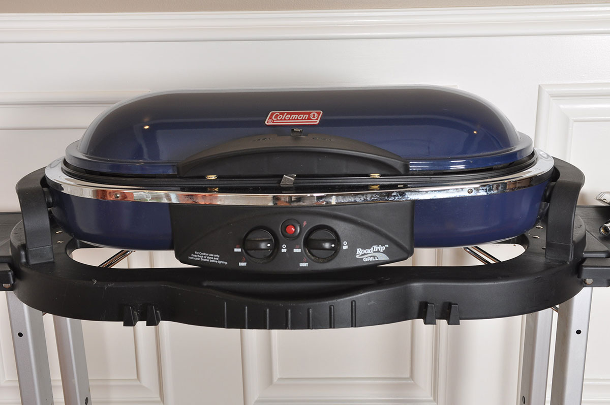 Coleman "Road Trip" Propane Grill with Folding Stand and Wheeled Carrying Case