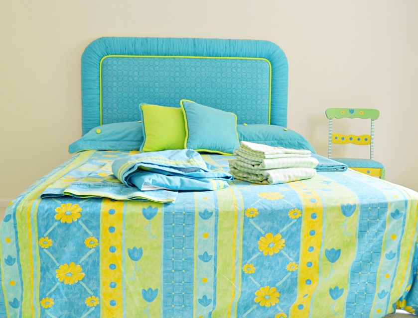 Twin Size Bed, Bedding Ensemble and Chair