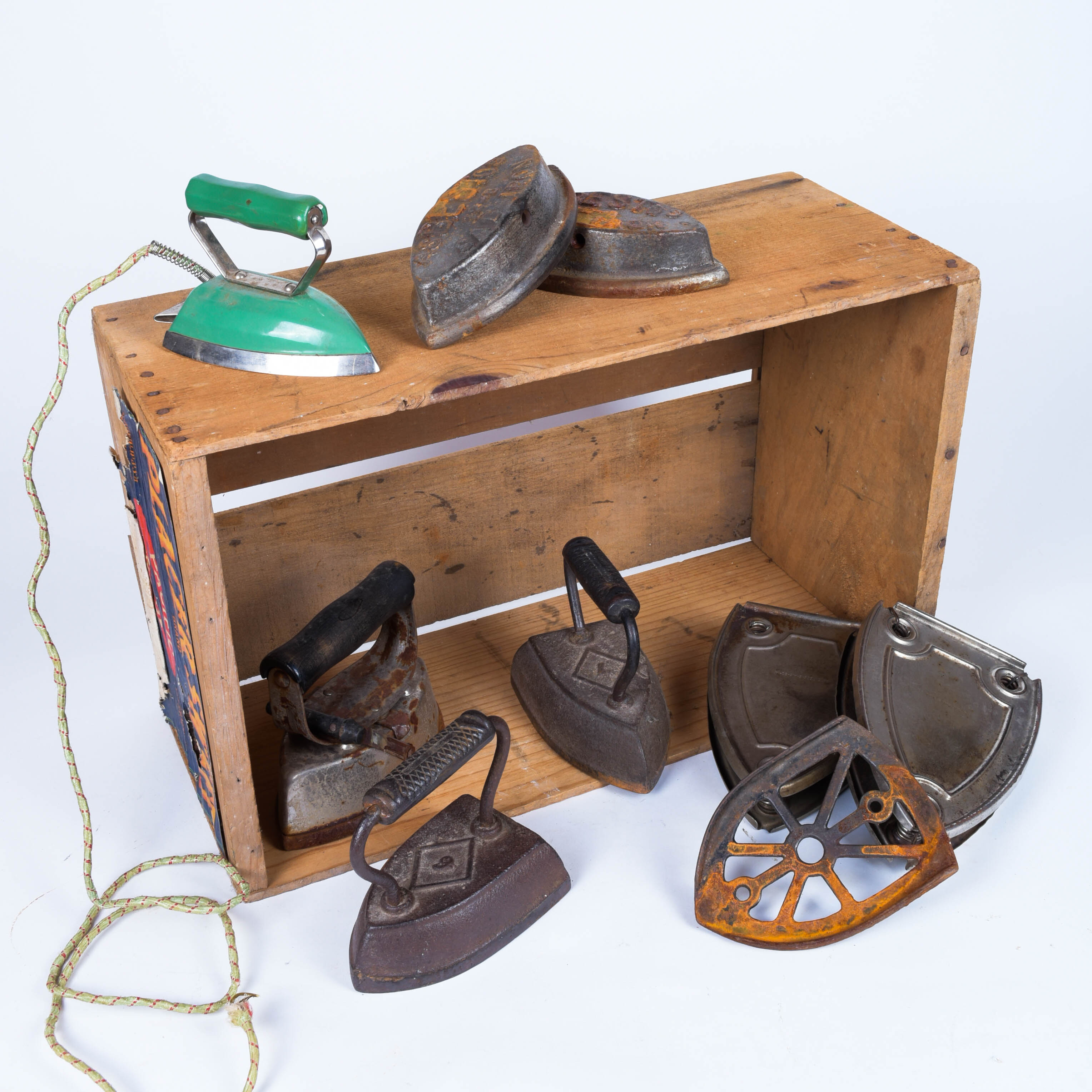 Sad Iron Collection in a Vintage Fruit Crate