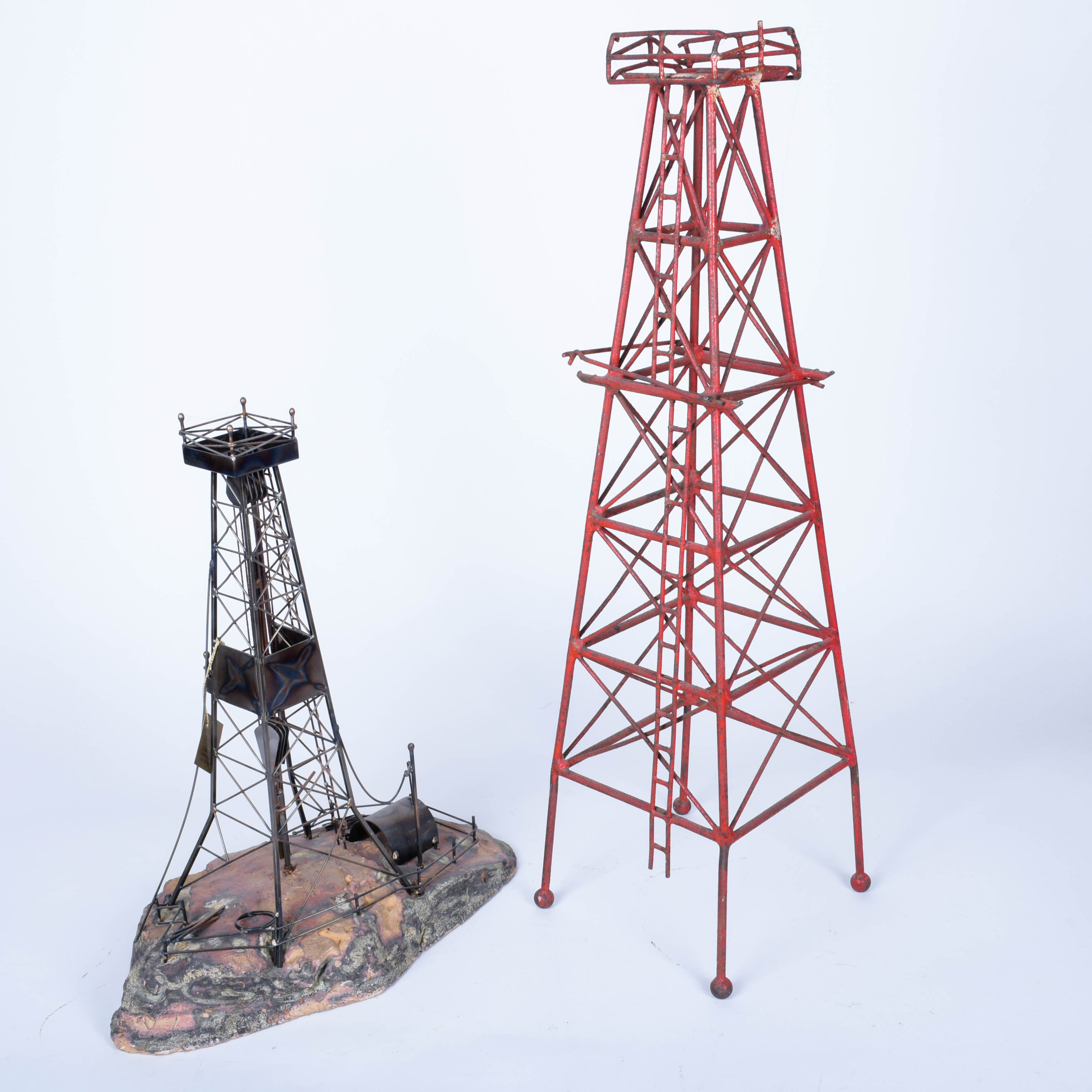 Two Oil Derrick Sculptures