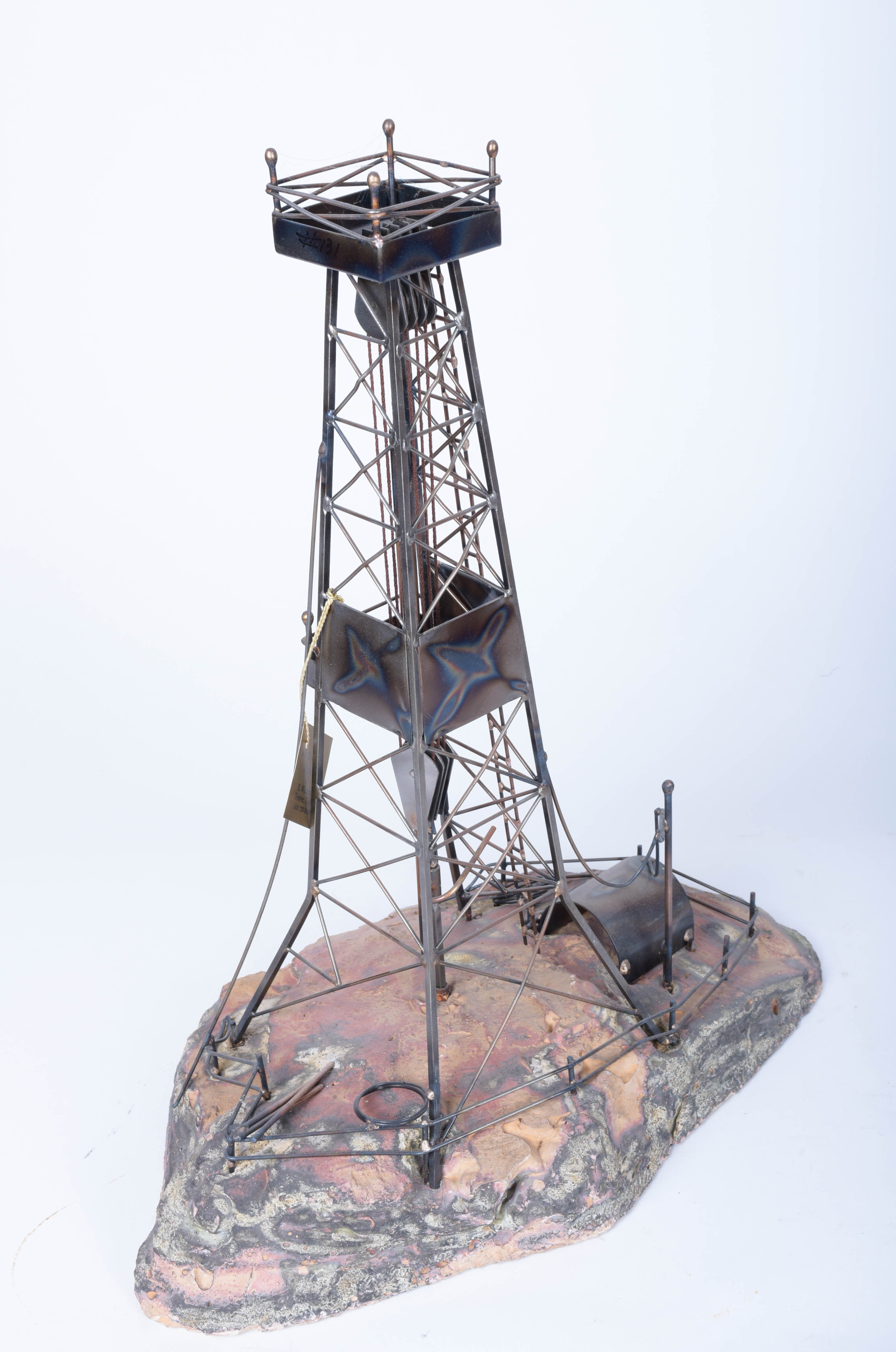 Two Oil Derrick Sculptures