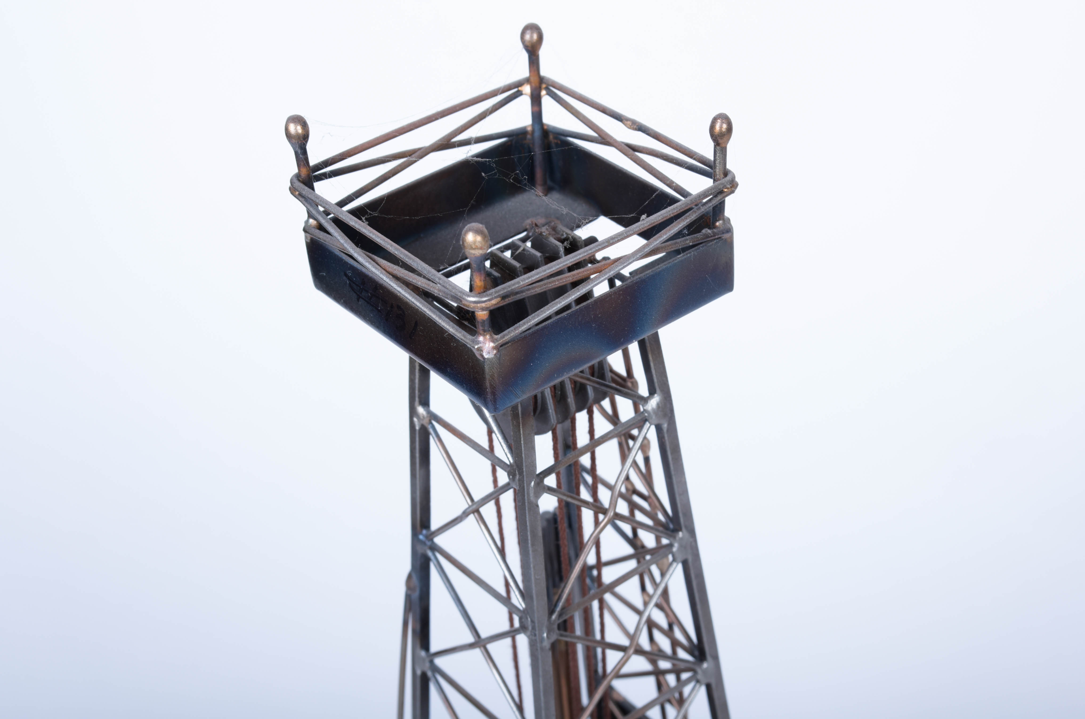 Two Oil Derrick Sculptures