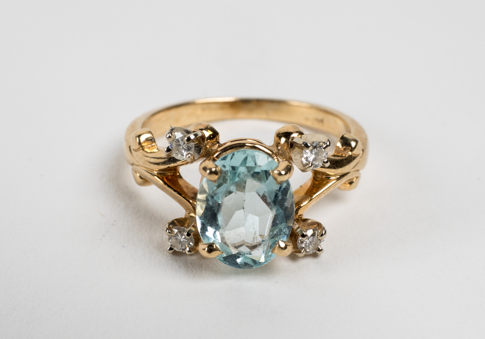 14 Karat Gold 1.54 CT Oval Cut Aquamarine and Diamond Ring