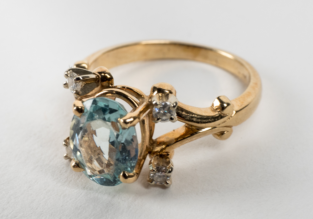 14 Karat Gold 1.54 CT Oval Cut Aquamarine and Diamond Ring