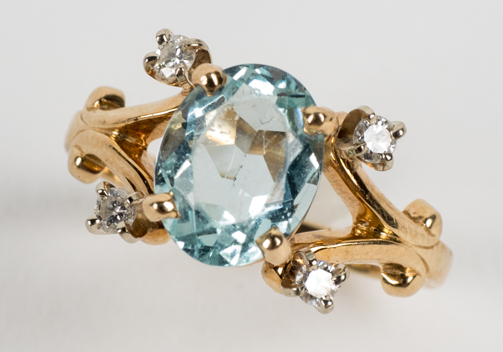 14 Karat Gold 1.54 CT Oval Cut Aquamarine and Diamond Ring