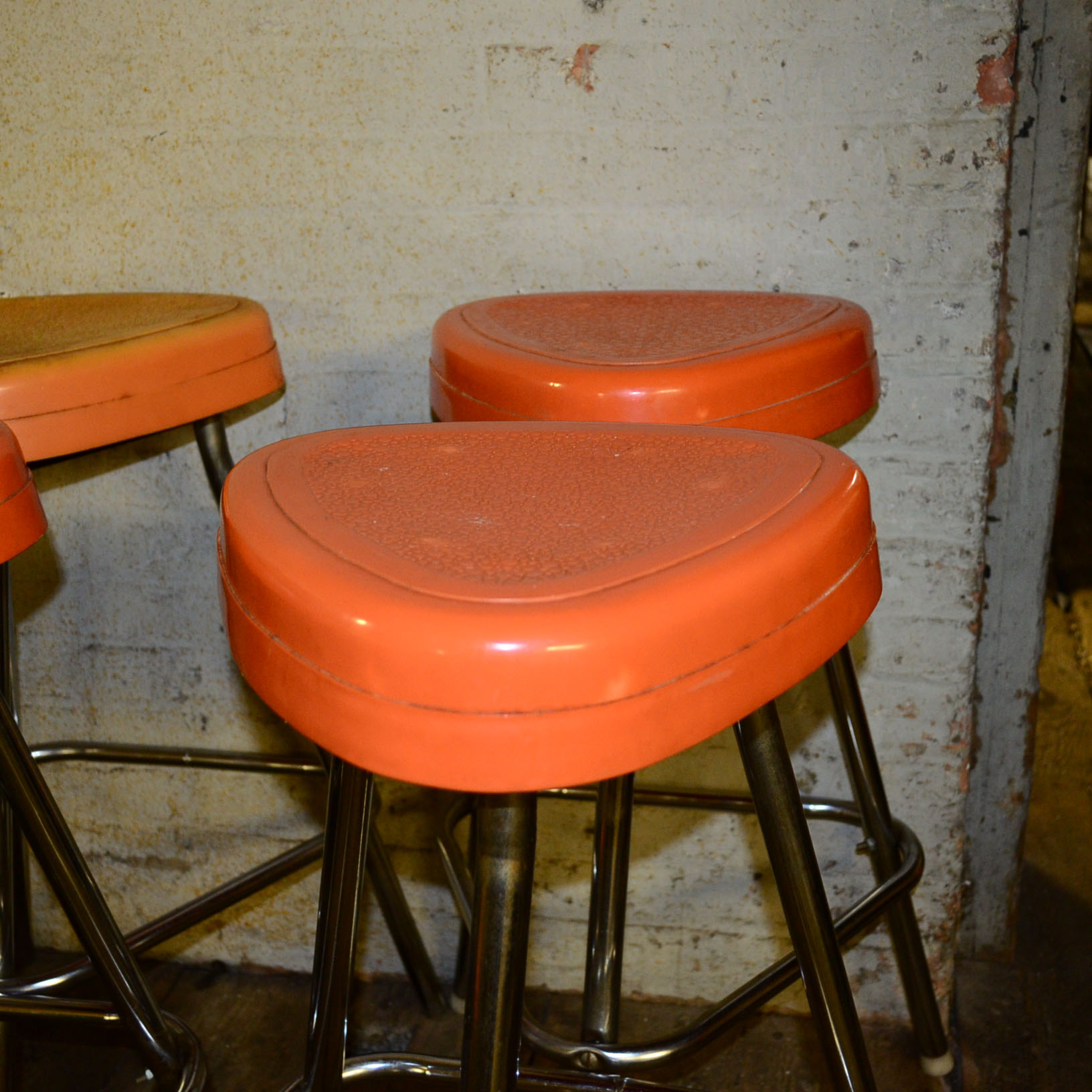 Circa 1950s Retro Snyder Orange Plastic and Chrome Bar Stools