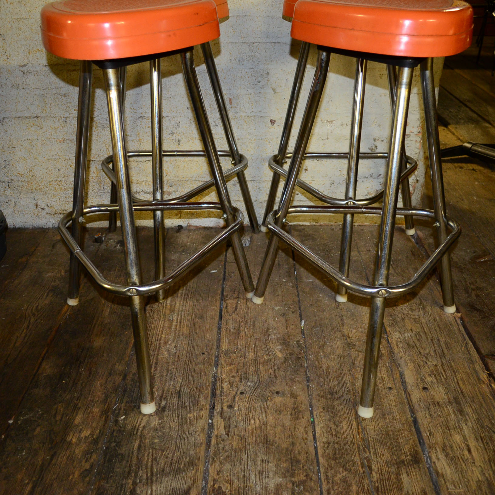 Circa 1950s Retro Snyder Orange Plastic and Chrome Bar Stools