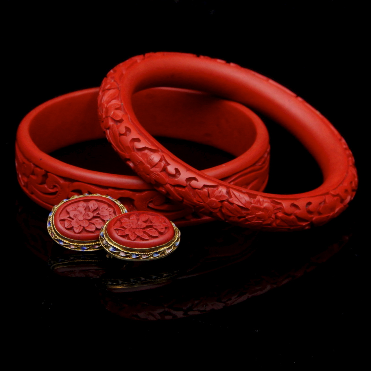 Pair of Carved Cinnabar Bangles and Earrings