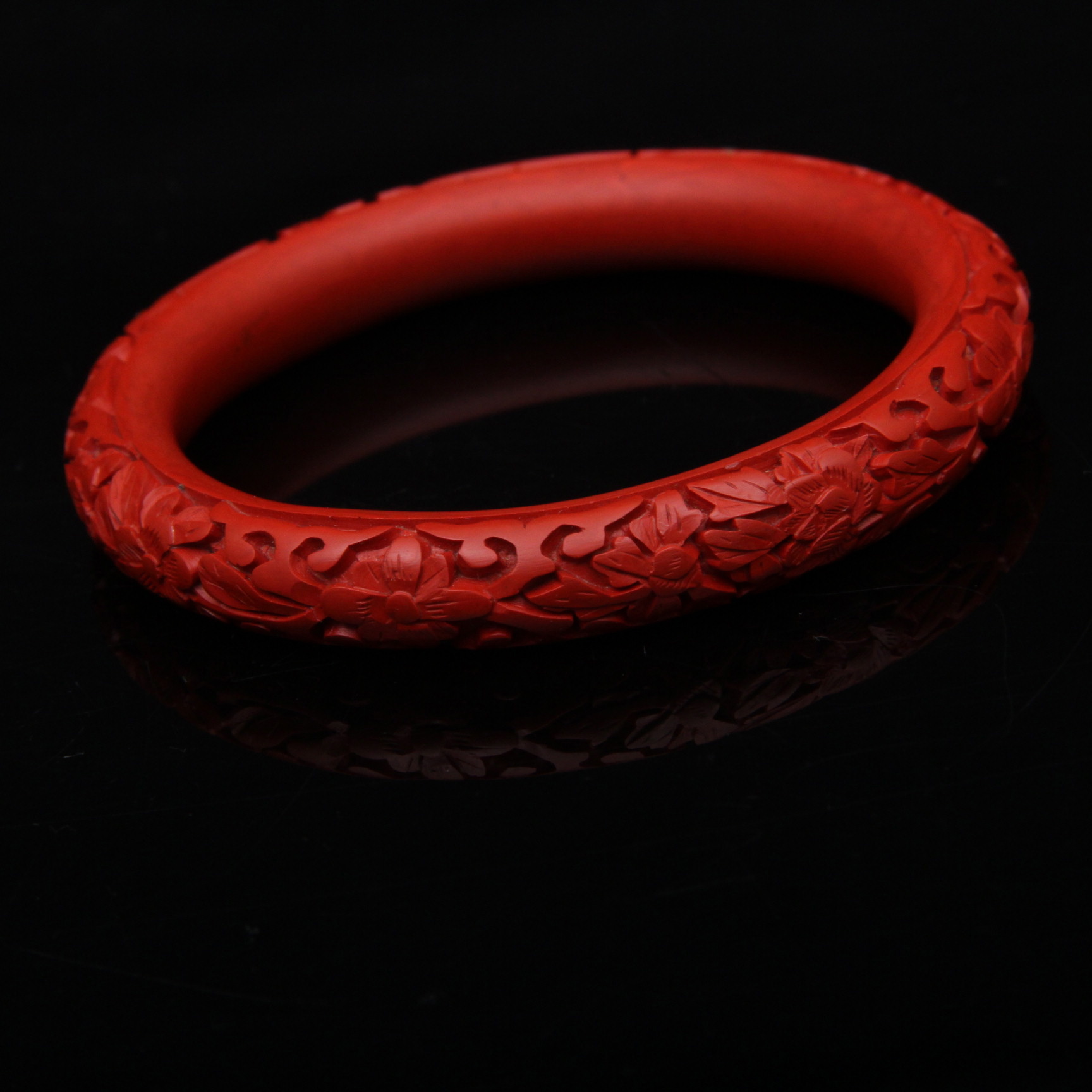Pair of Carved Cinnabar Bangles and Earrings