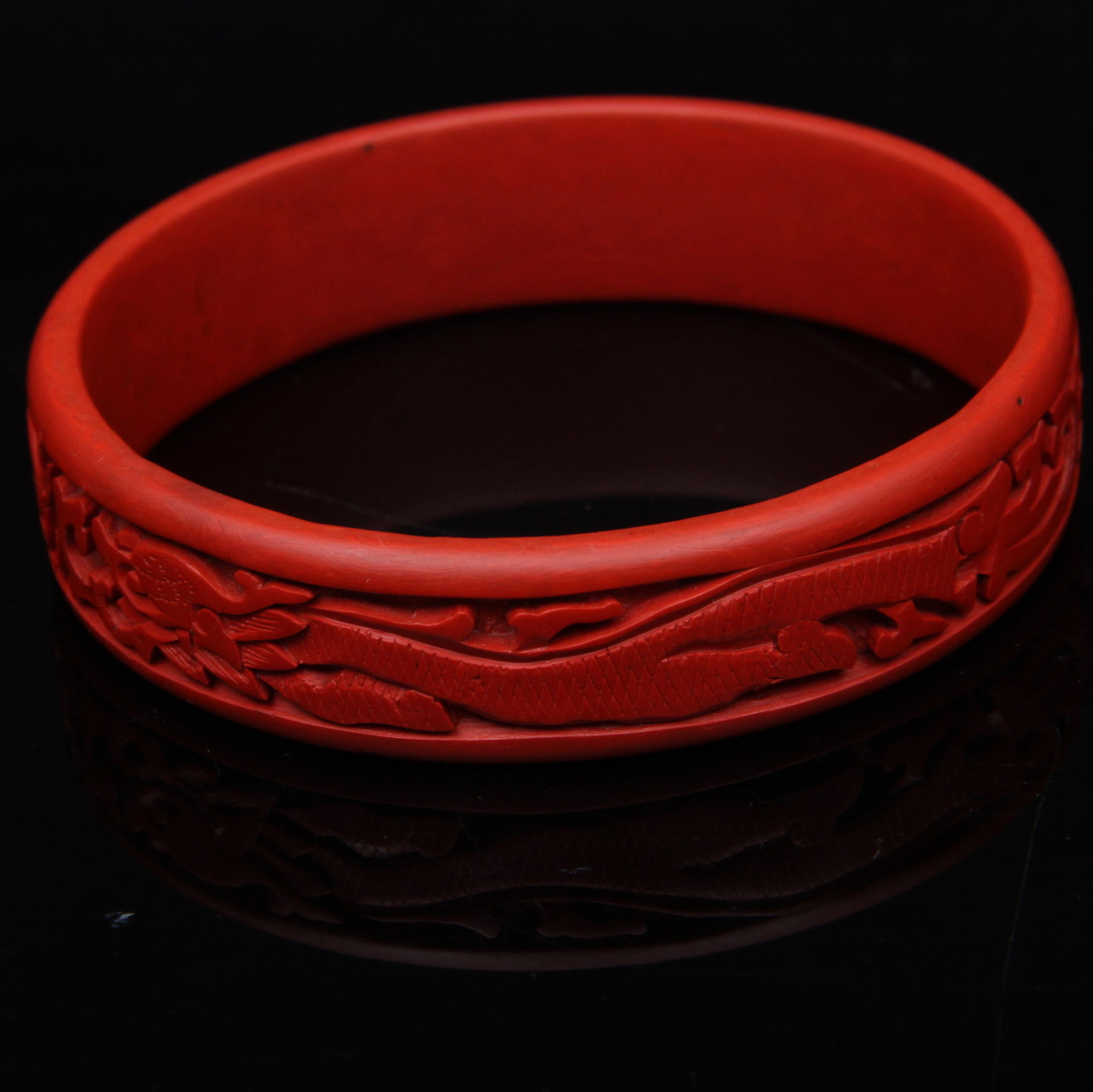 Pair of Carved Cinnabar Bangles and Earrings