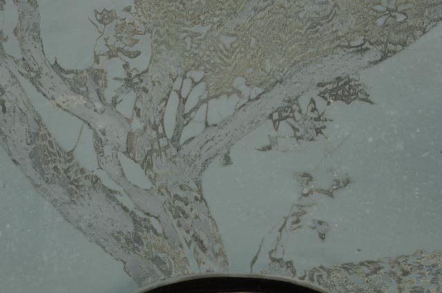 Collaged Steel Intaglio Plates and Faux Wood Veneer on Black Acrylic Substrate