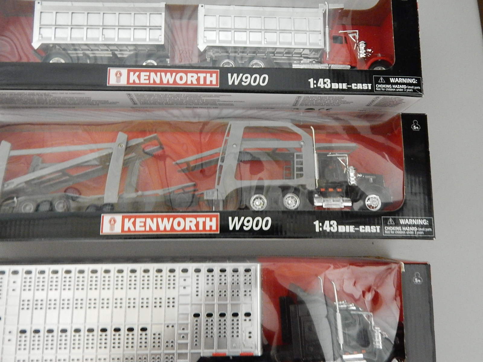 Three Kenworth Toy Tractor Trailer Trucks