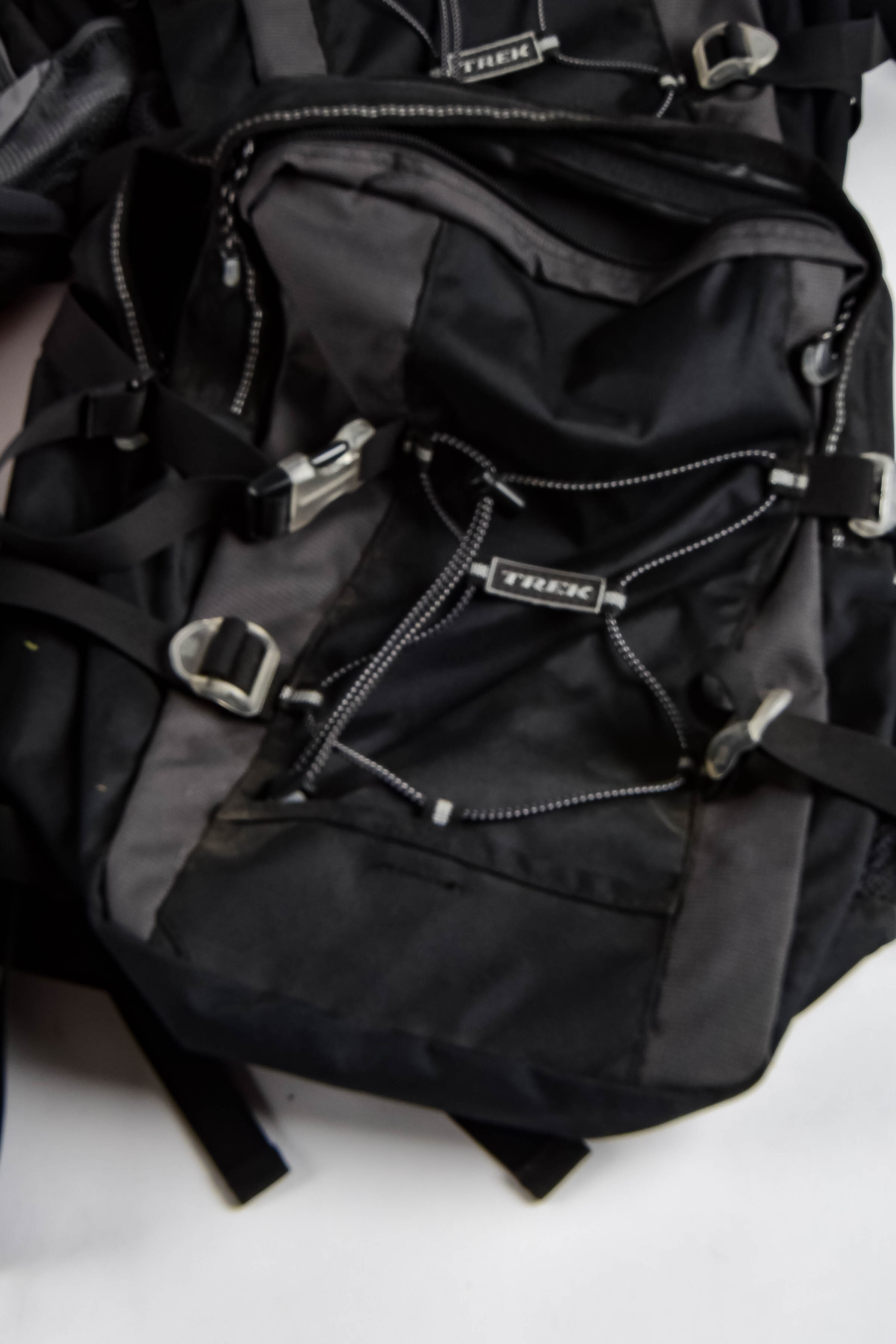 Four Black and Red Backpacks Including Trek