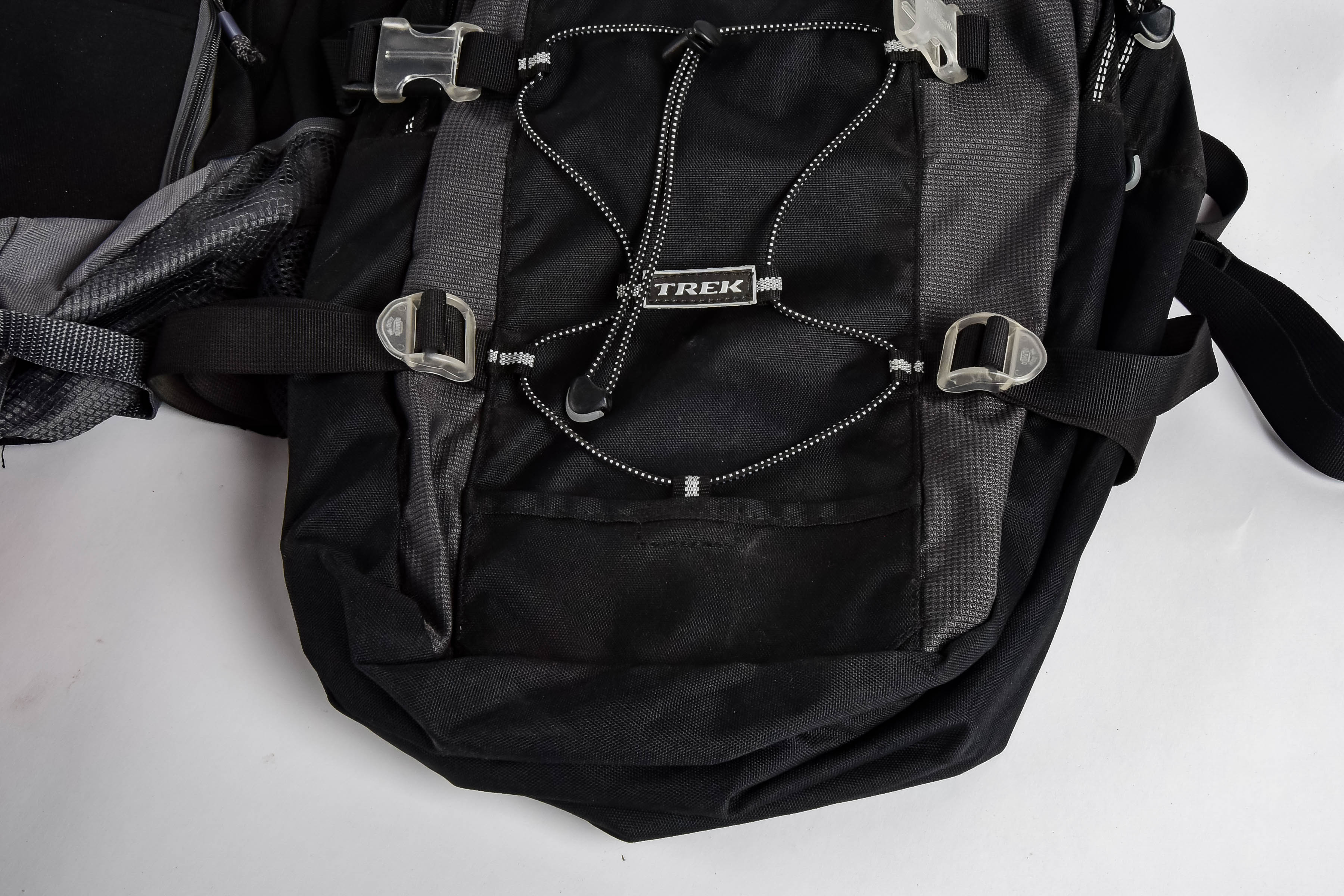 Four Black and Red Backpacks Including Trek