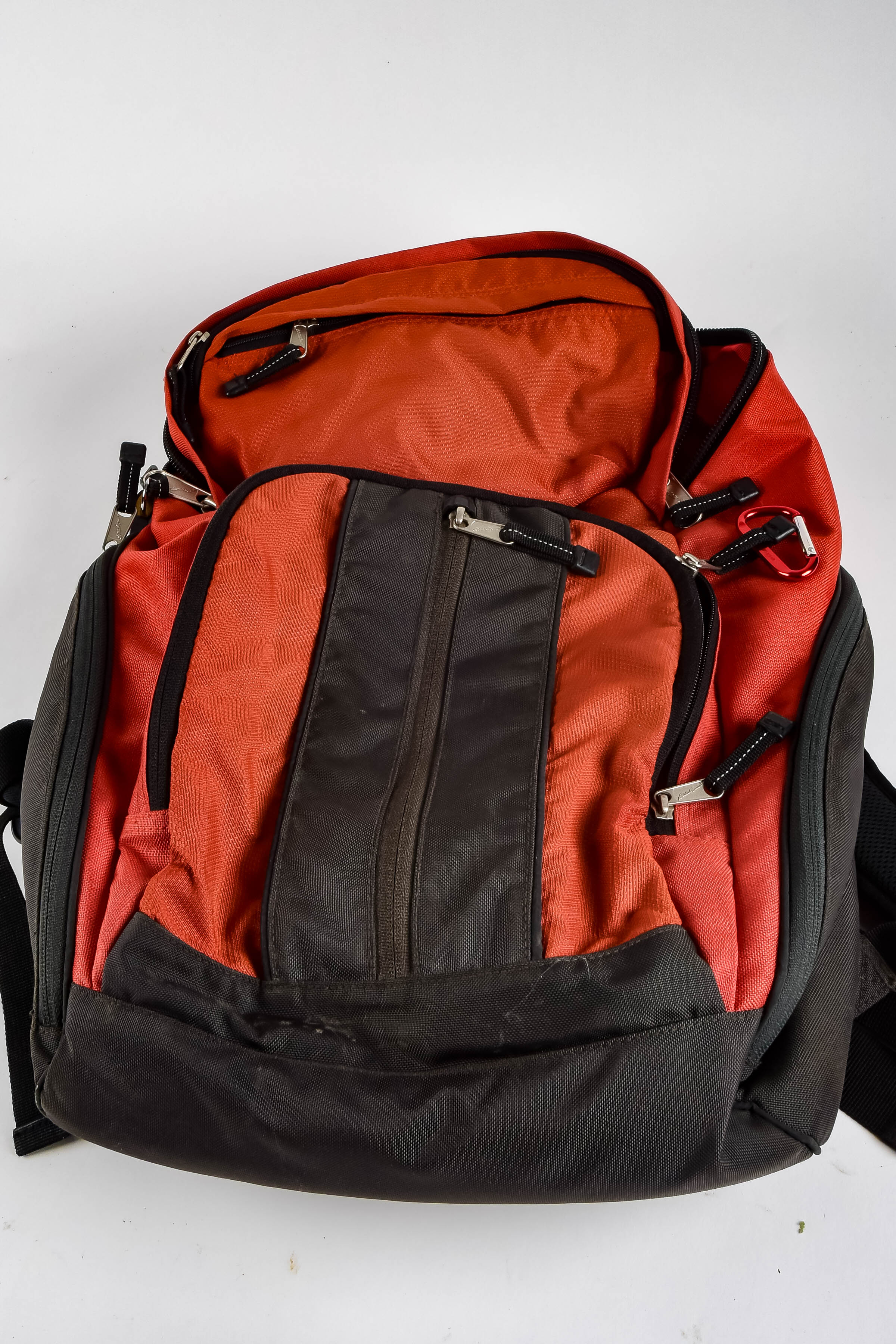 Four Black and Red Backpacks Including Trek