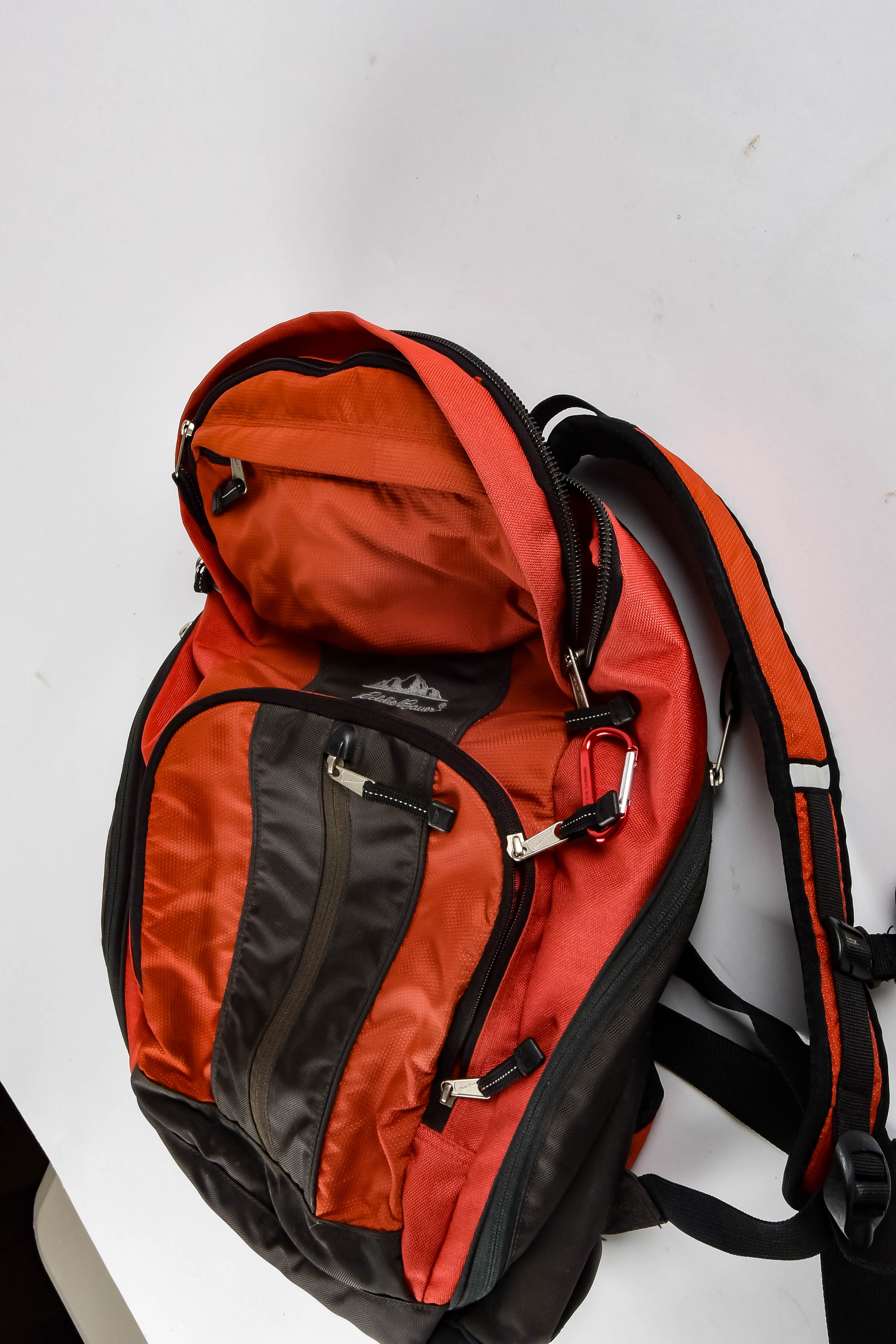 Four Black and Red Backpacks Including Trek