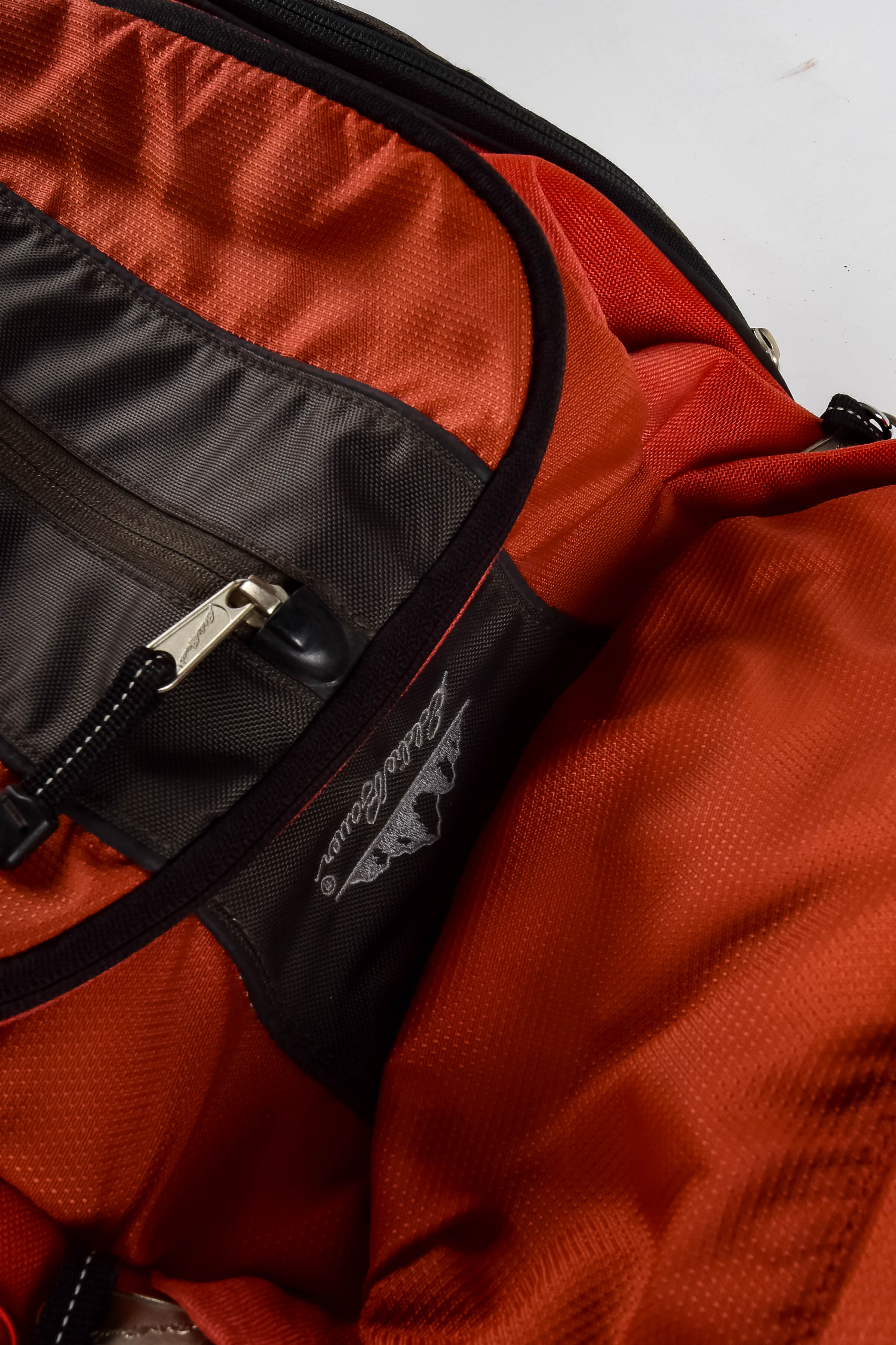 Four Black and Red Backpacks Including Trek