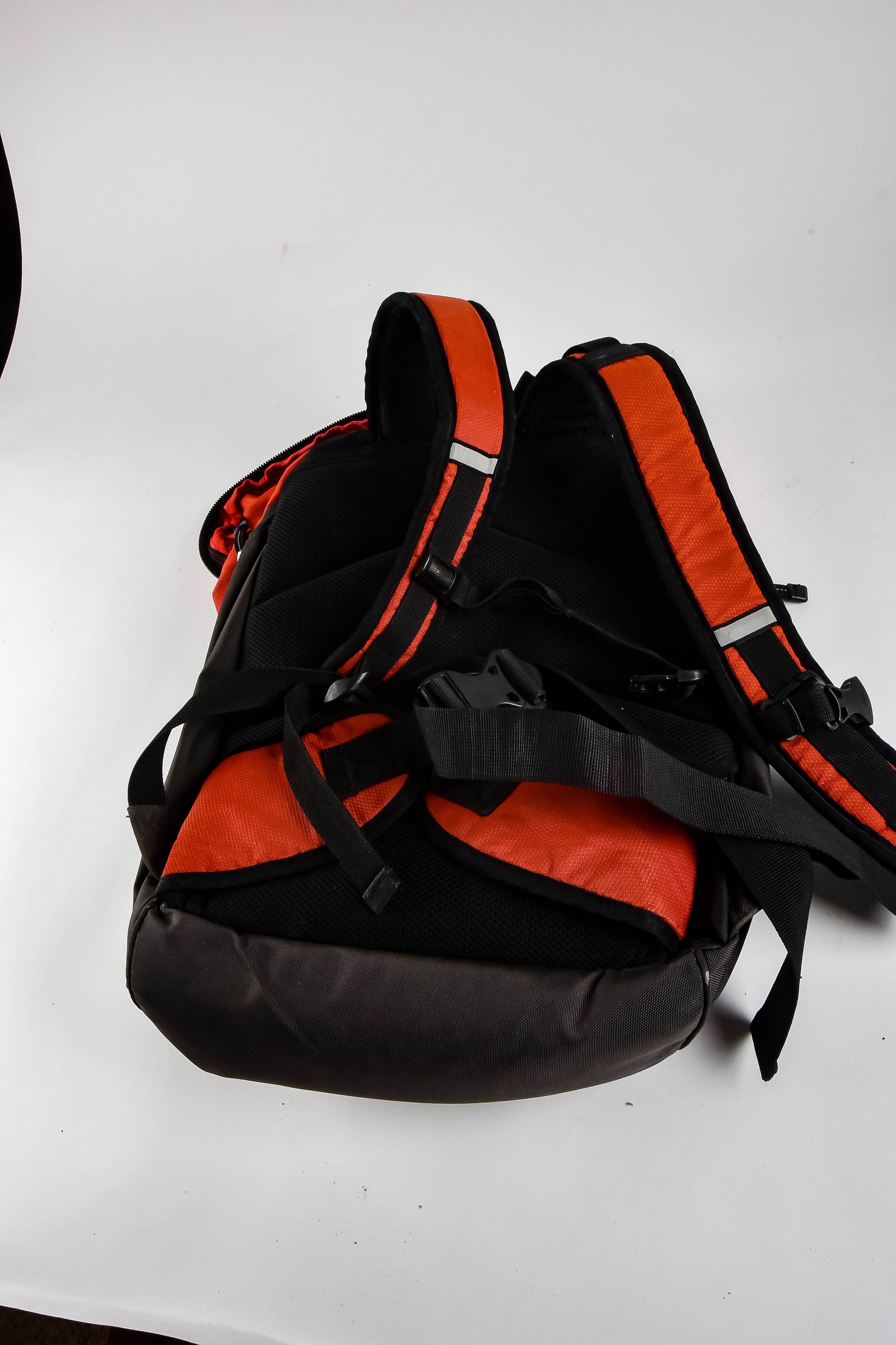 Four Black and Red Backpacks Including Trek