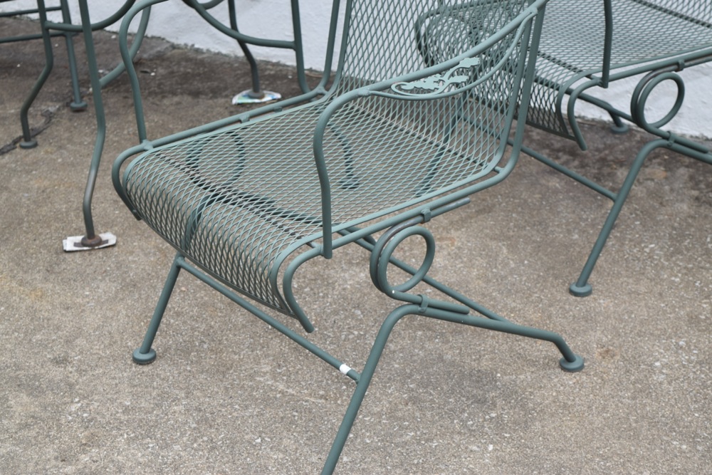 Wrought Iron Patio Table and Four Wrought Iron Rocking Chairs
