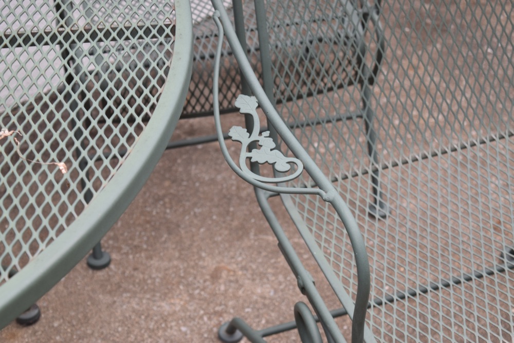 Wrought Iron Patio Table and Four Wrought Iron Rocking Chairs