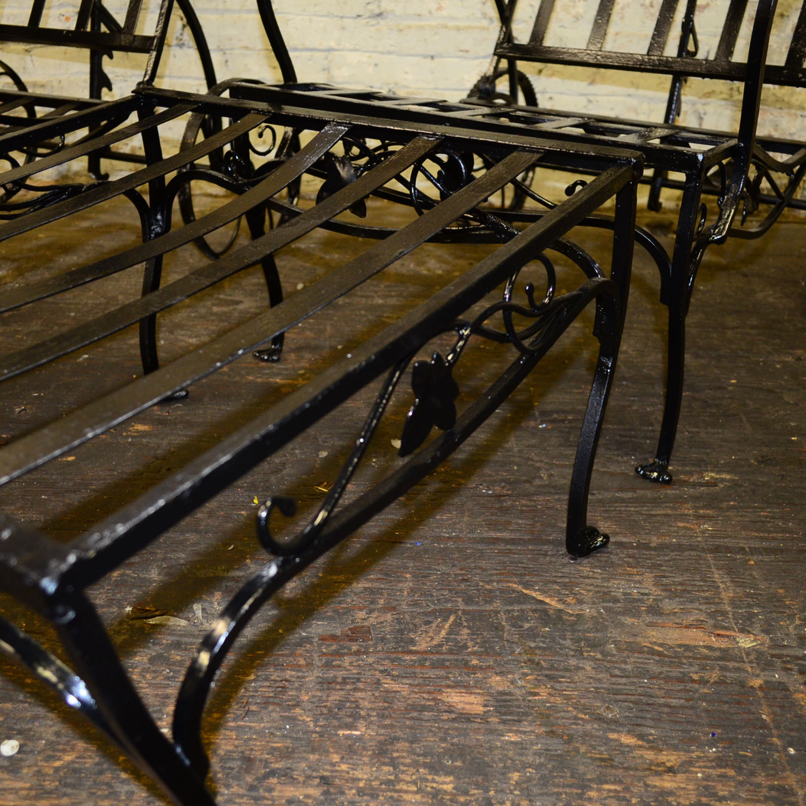 Pair of Cast Iron Lounge Chairs And Ottomans