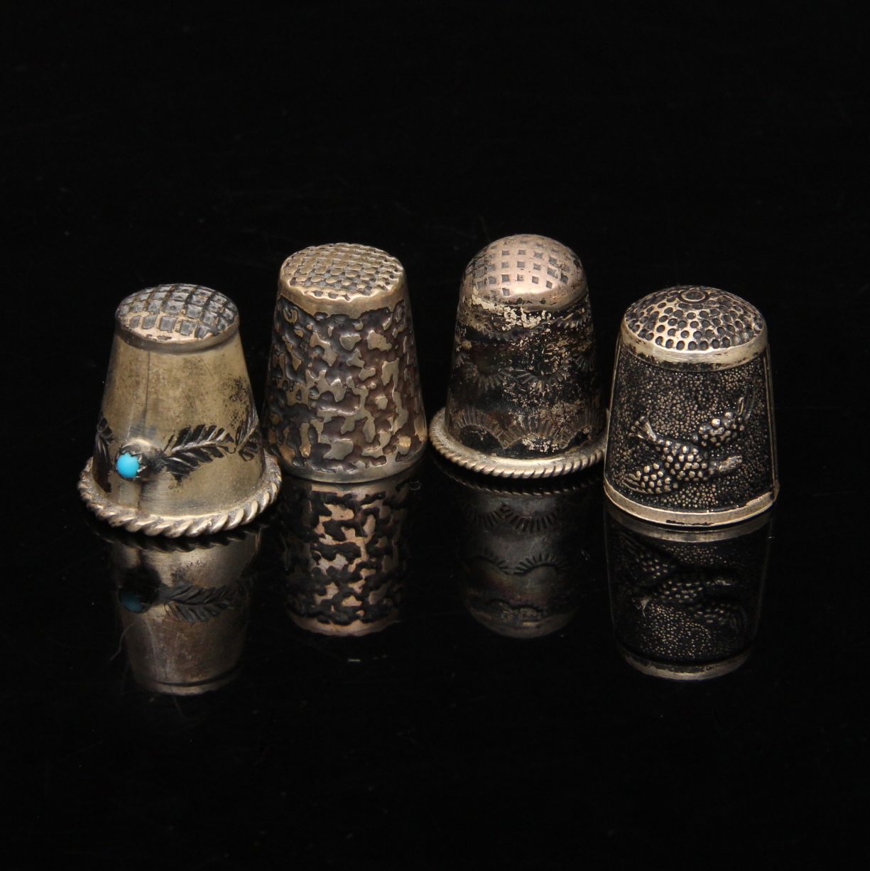 Four Sterling Silver Thimbles
