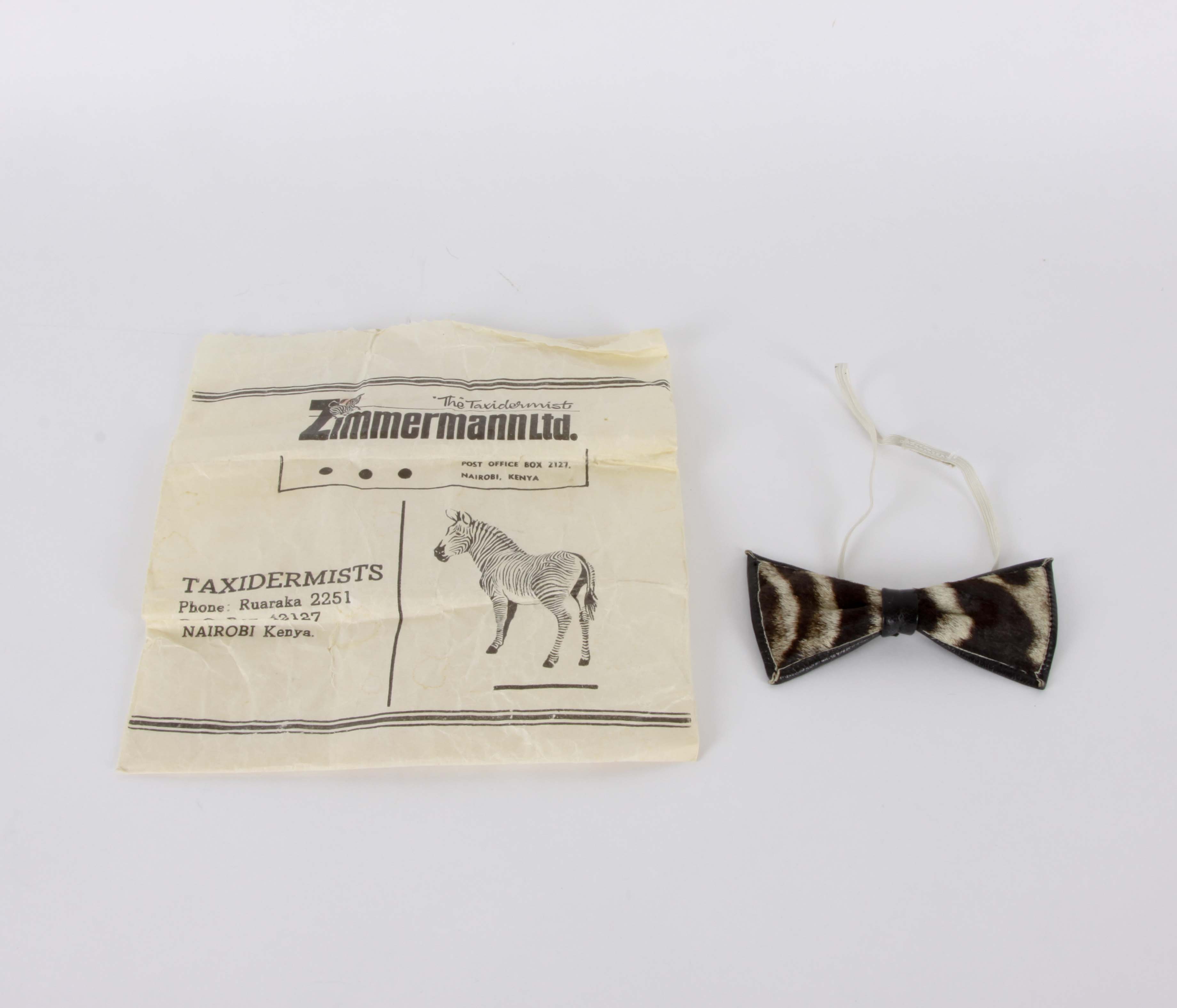 Genuine Zebra Hide Bowtie and Carved Kenyan Figurine