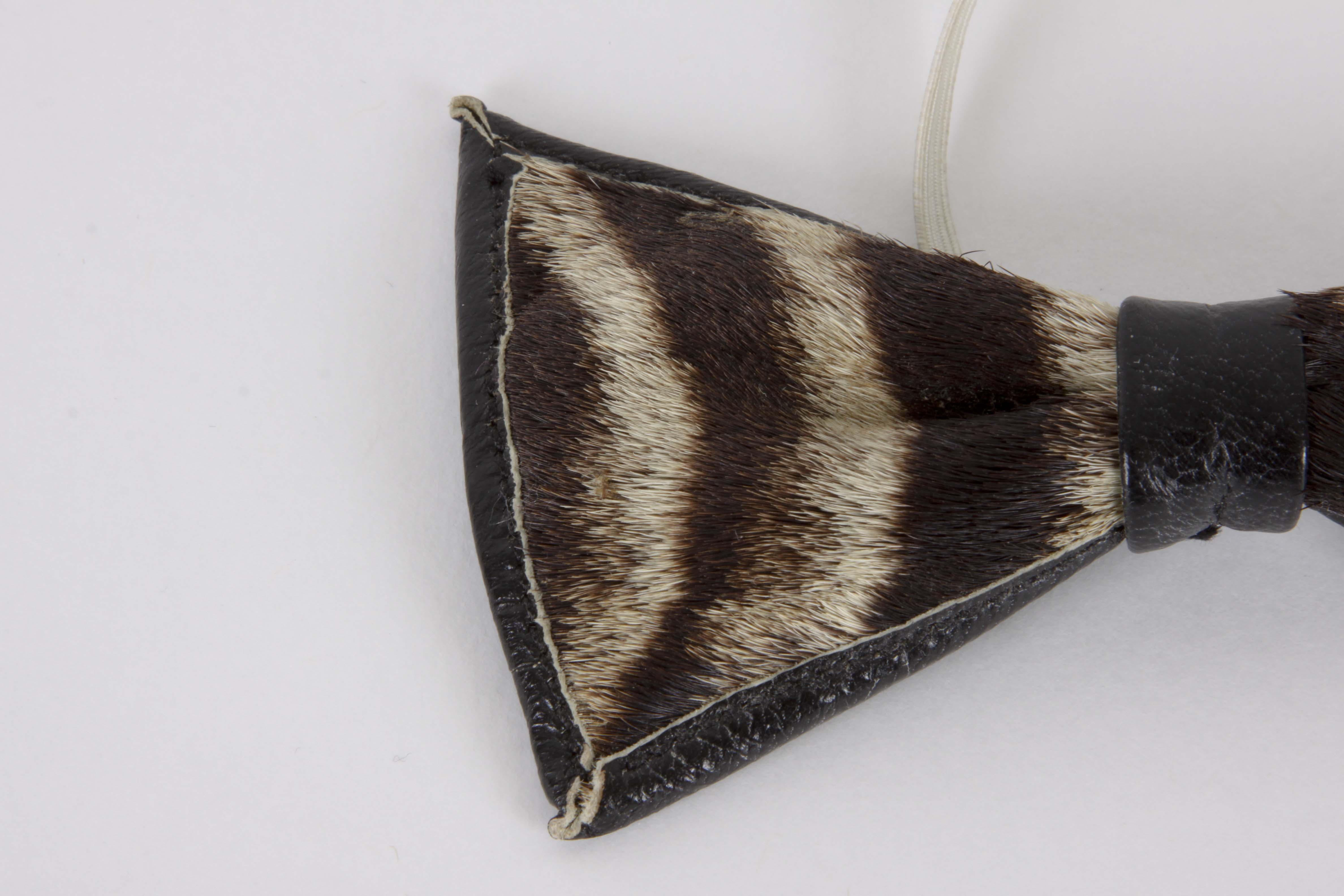 Genuine Zebra Hide Bowtie and Carved Kenyan Figurine