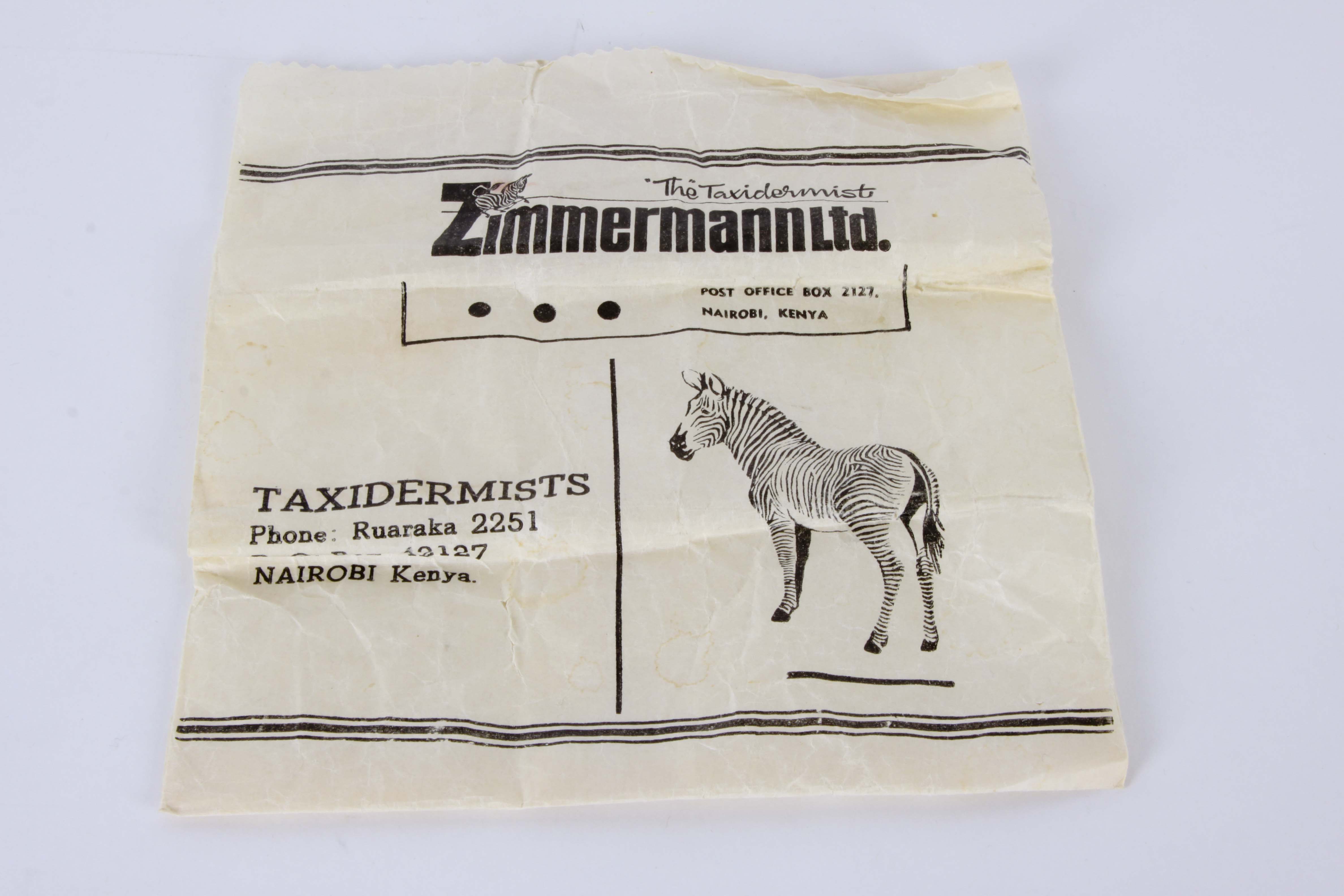 Genuine Zebra Hide Bowtie and Carved Kenyan Figurine