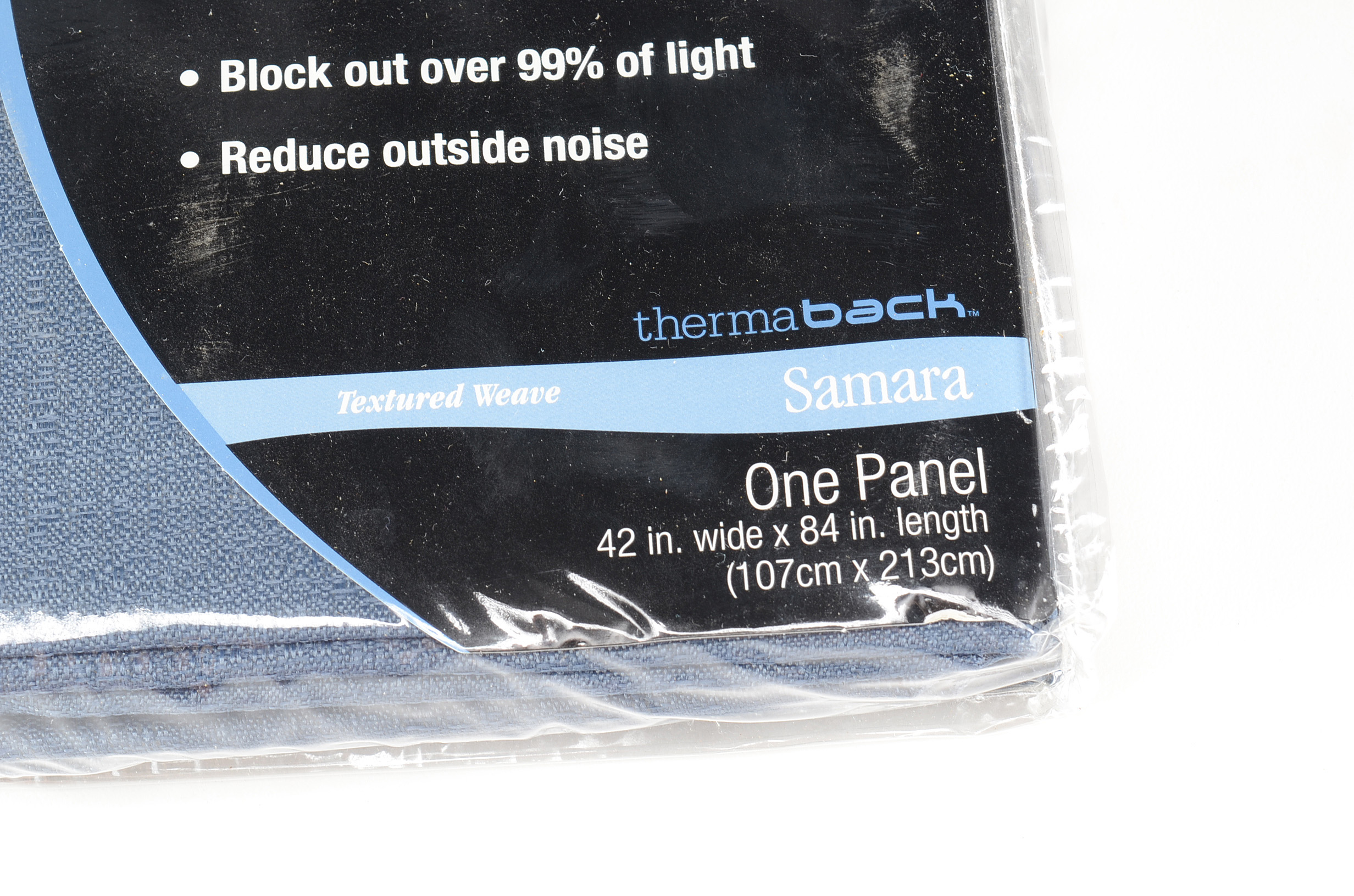 Eleven Curtain Panels and a Floor Lamp