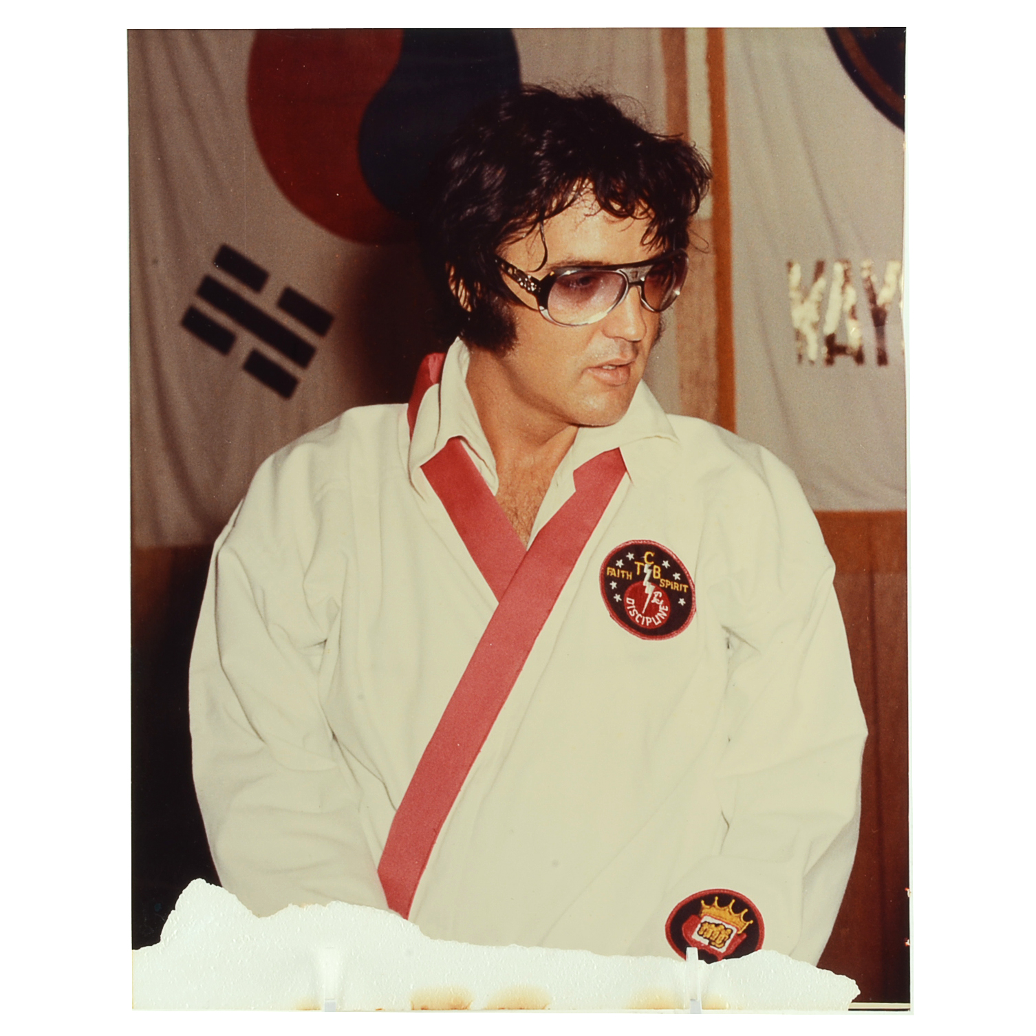 1970s Vintage Color Photograph of Elvis Presley Wearing Sunglasses and His Custom Made Martial Arts Gi Jumpsuit for a Film Shoot
