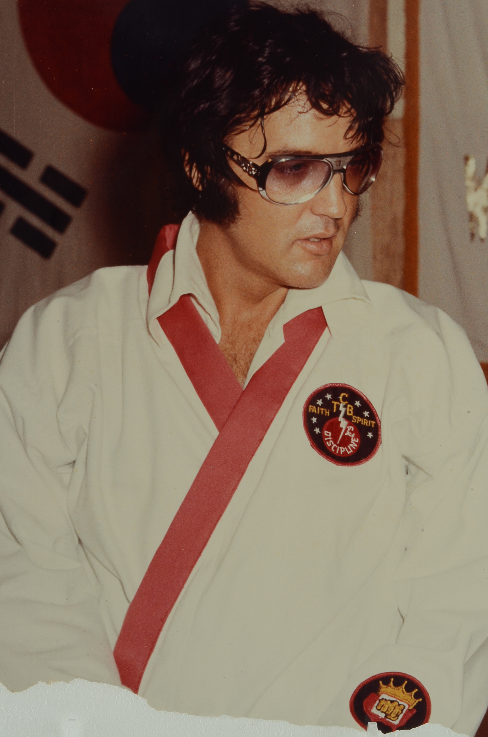 1970s Vintage Color Photograph of Elvis Presley Wearing Sunglasses and His Custom Made Martial Arts Gi Jumpsuit for a Film Shoot