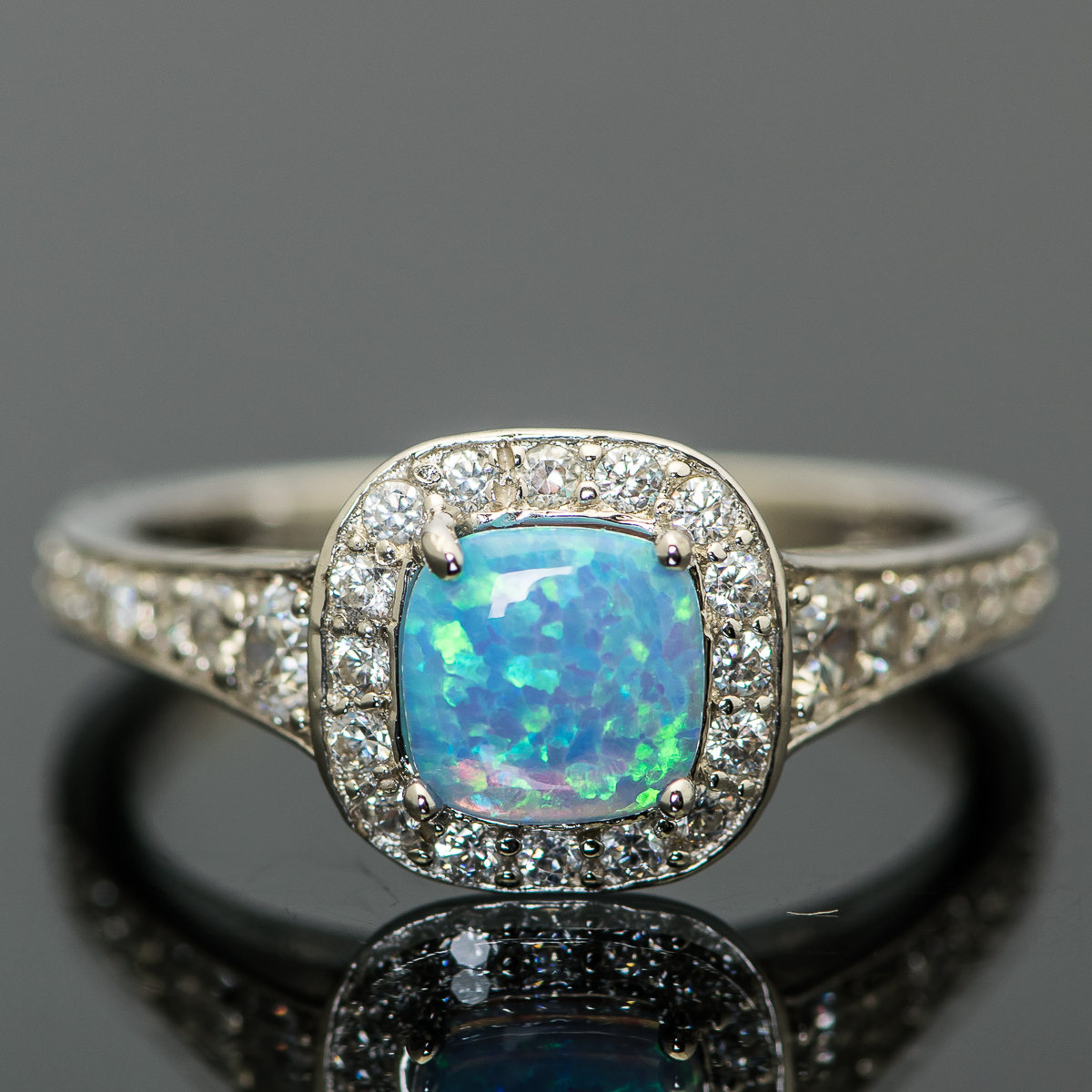 Sterling Silver and Synthetic Blue Opal Halo Ring