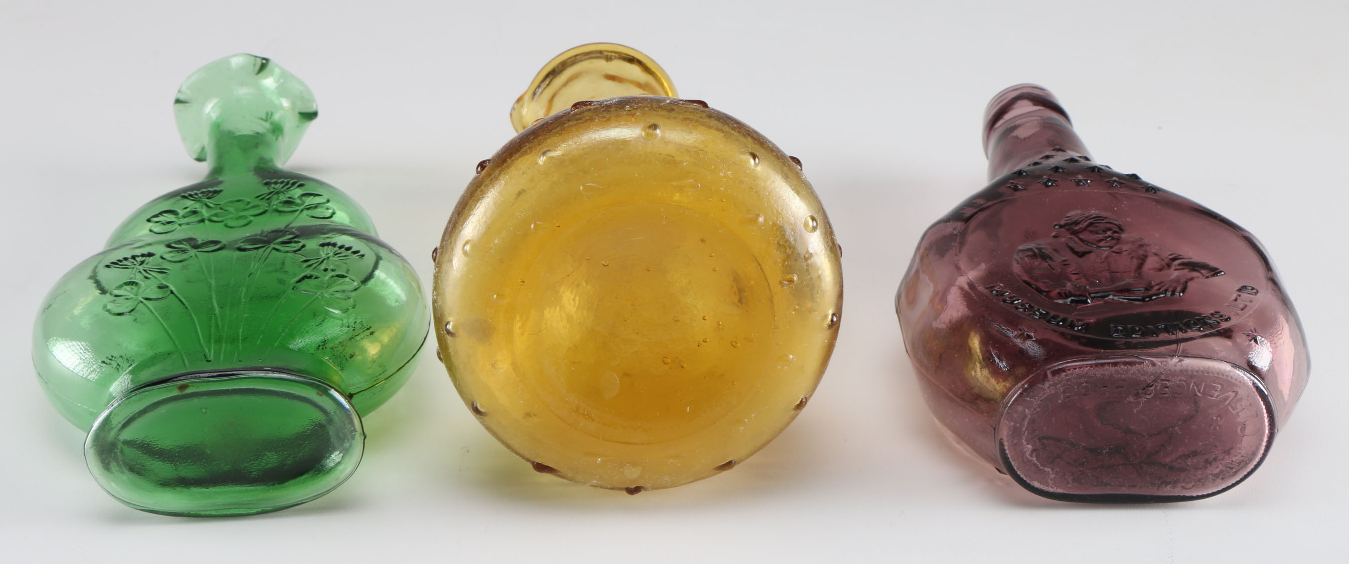 Assortment of Clevenger Brothers Colored Glass Bottles