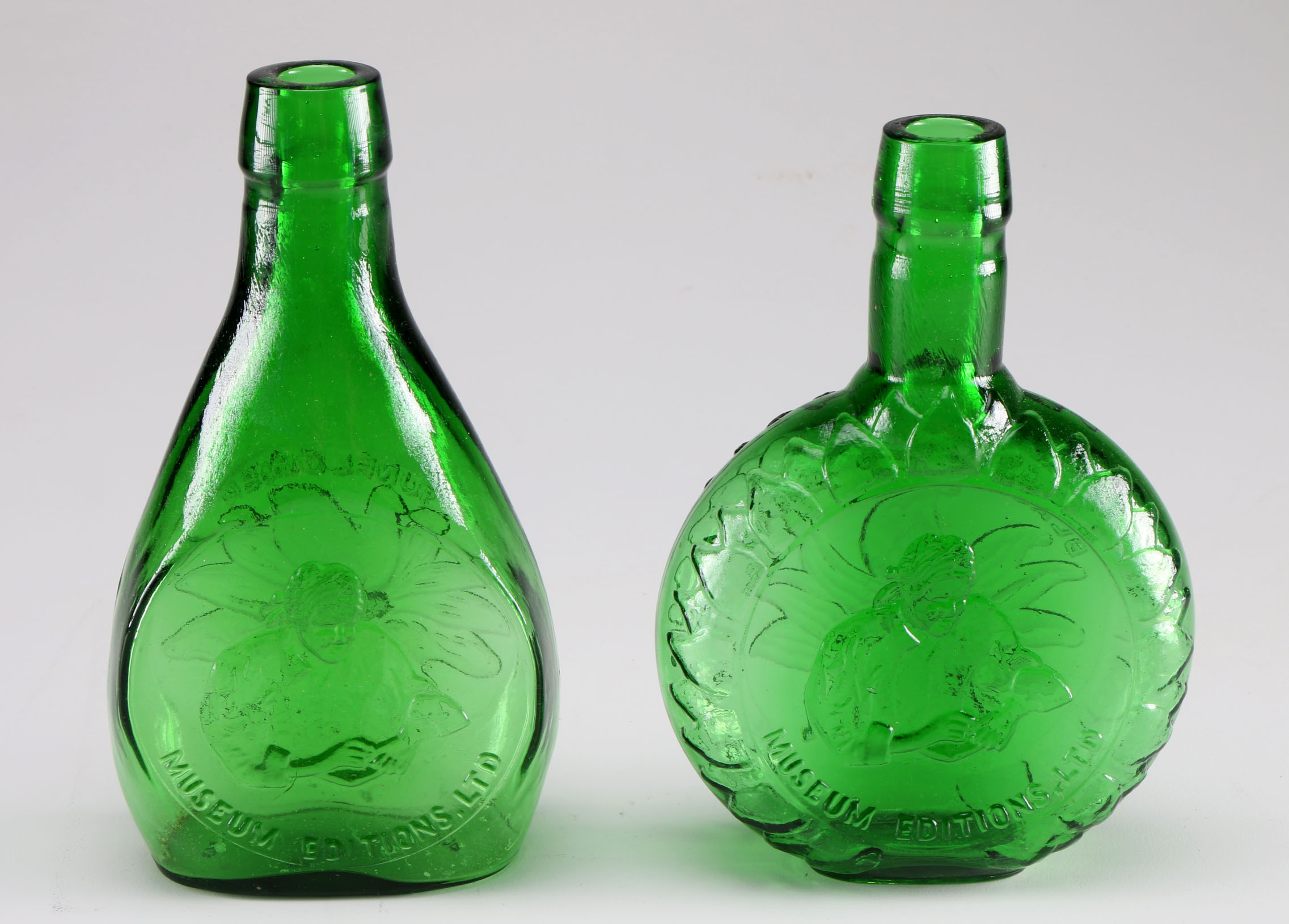 Assortment of Clevenger Brothers Colored Glass Bottles