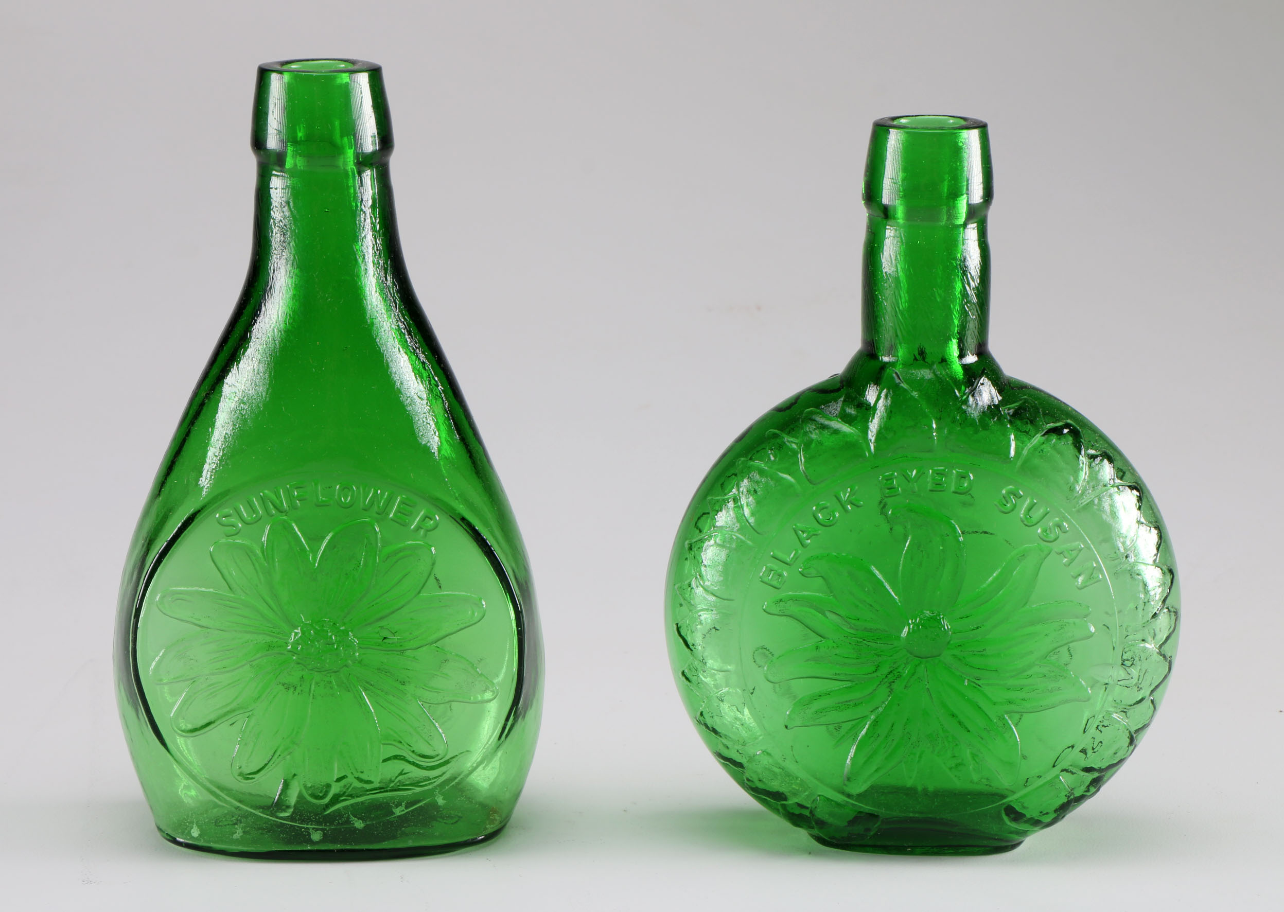 Assortment of Clevenger Brothers Colored Glass Bottles