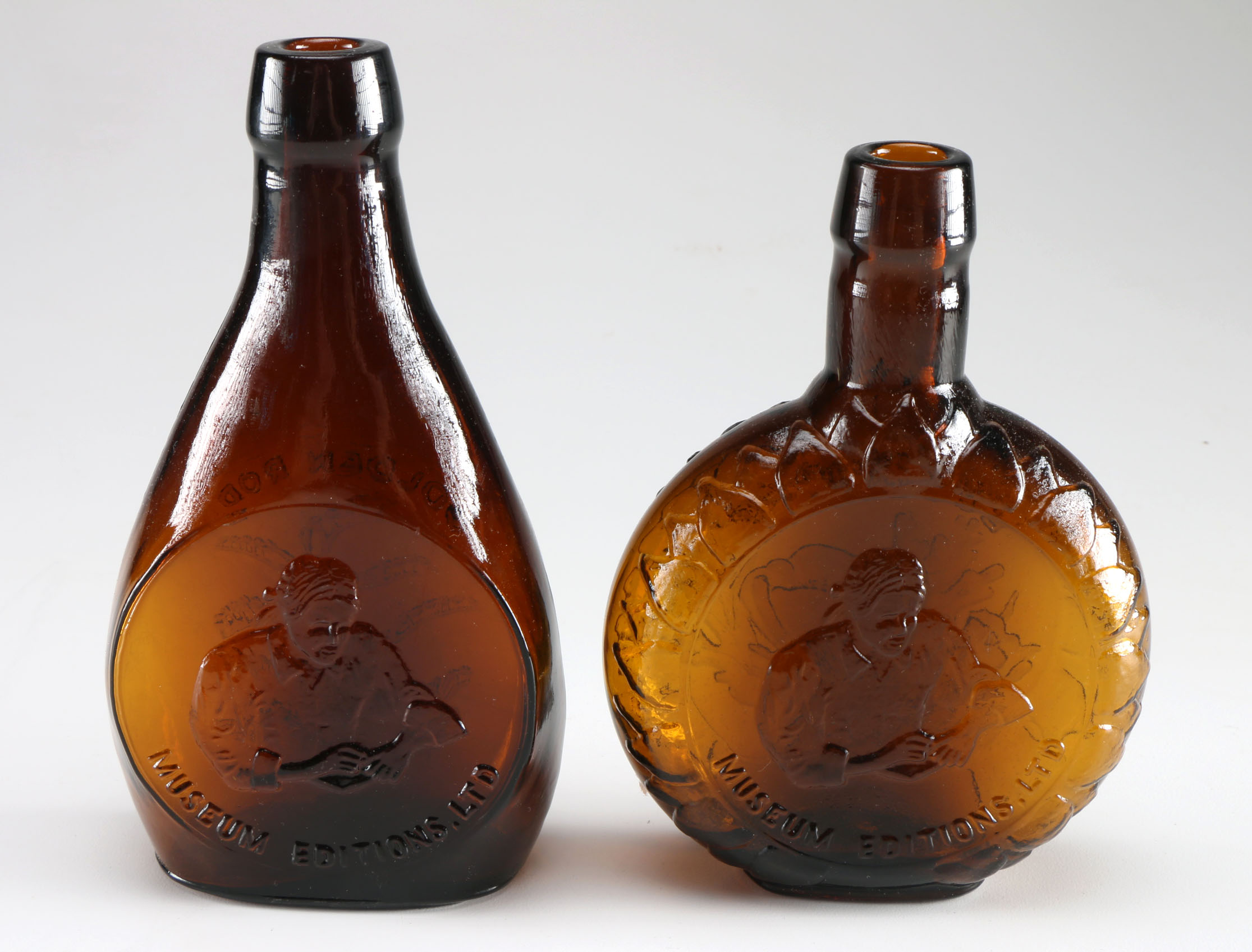 Assortment of Clevenger Brothers Colored Glass Bottles