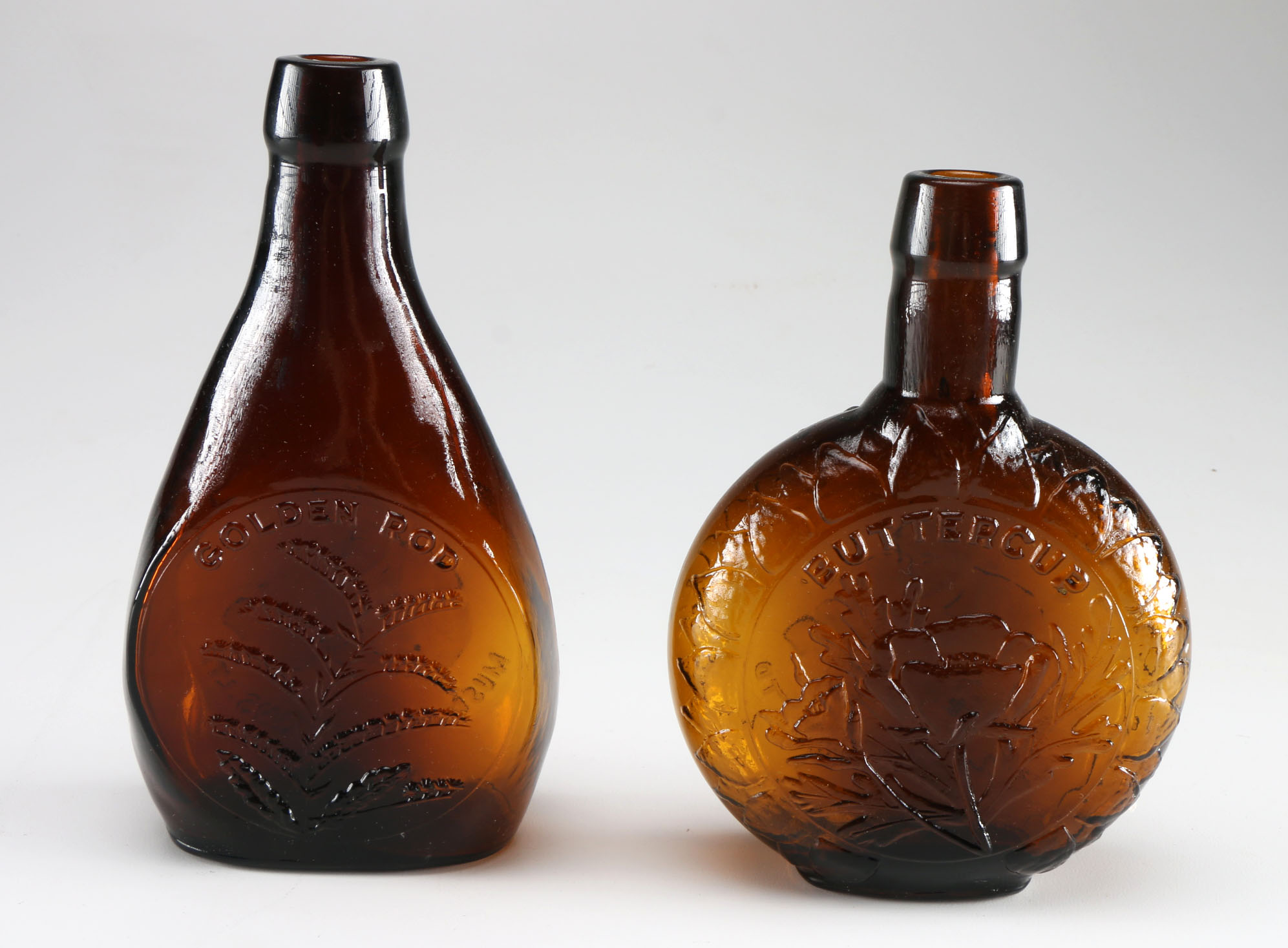 Assortment of Clevenger Brothers Colored Glass Bottles