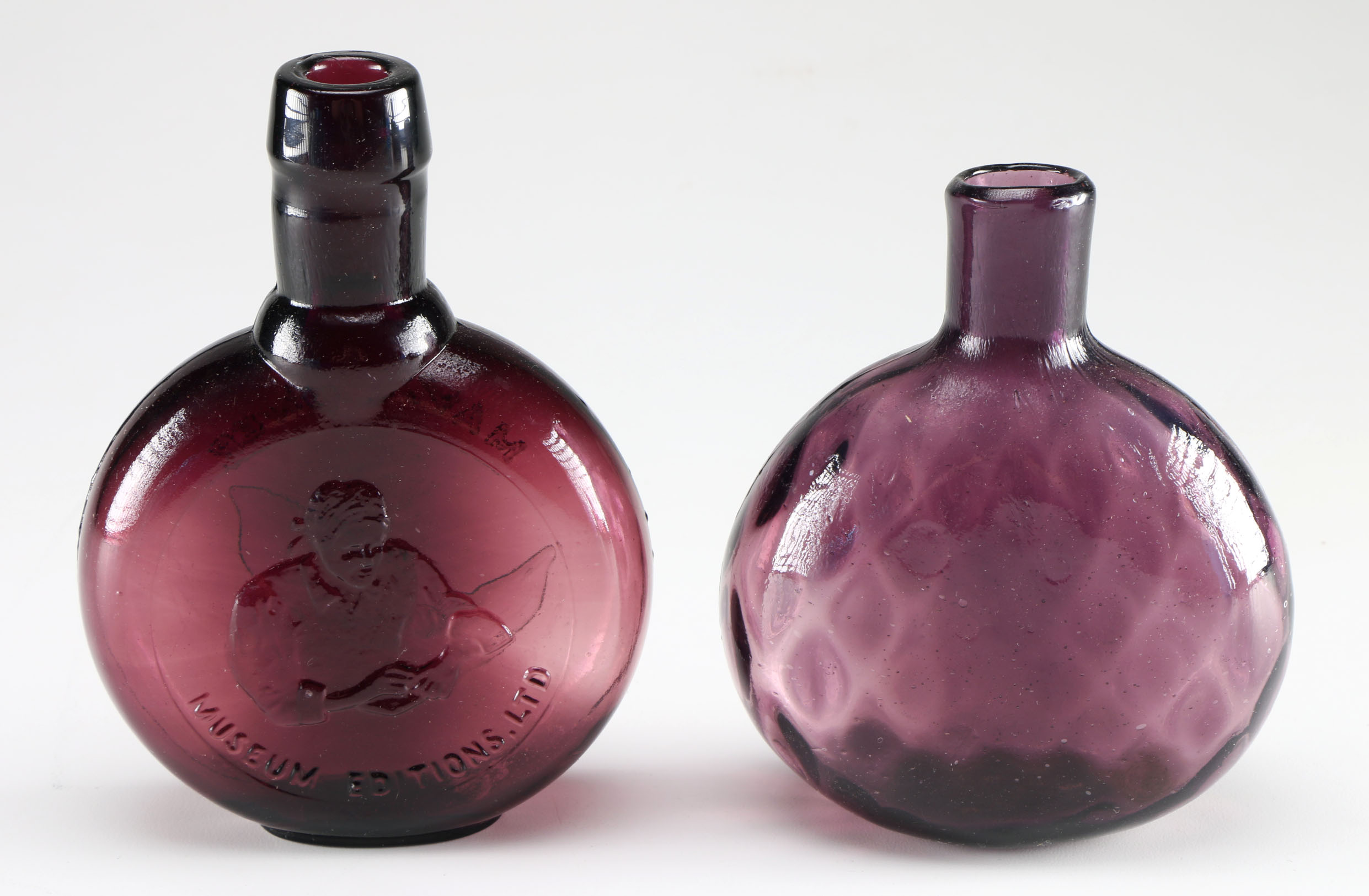 Assortment of Clevenger Brothers Colored Glass Bottles