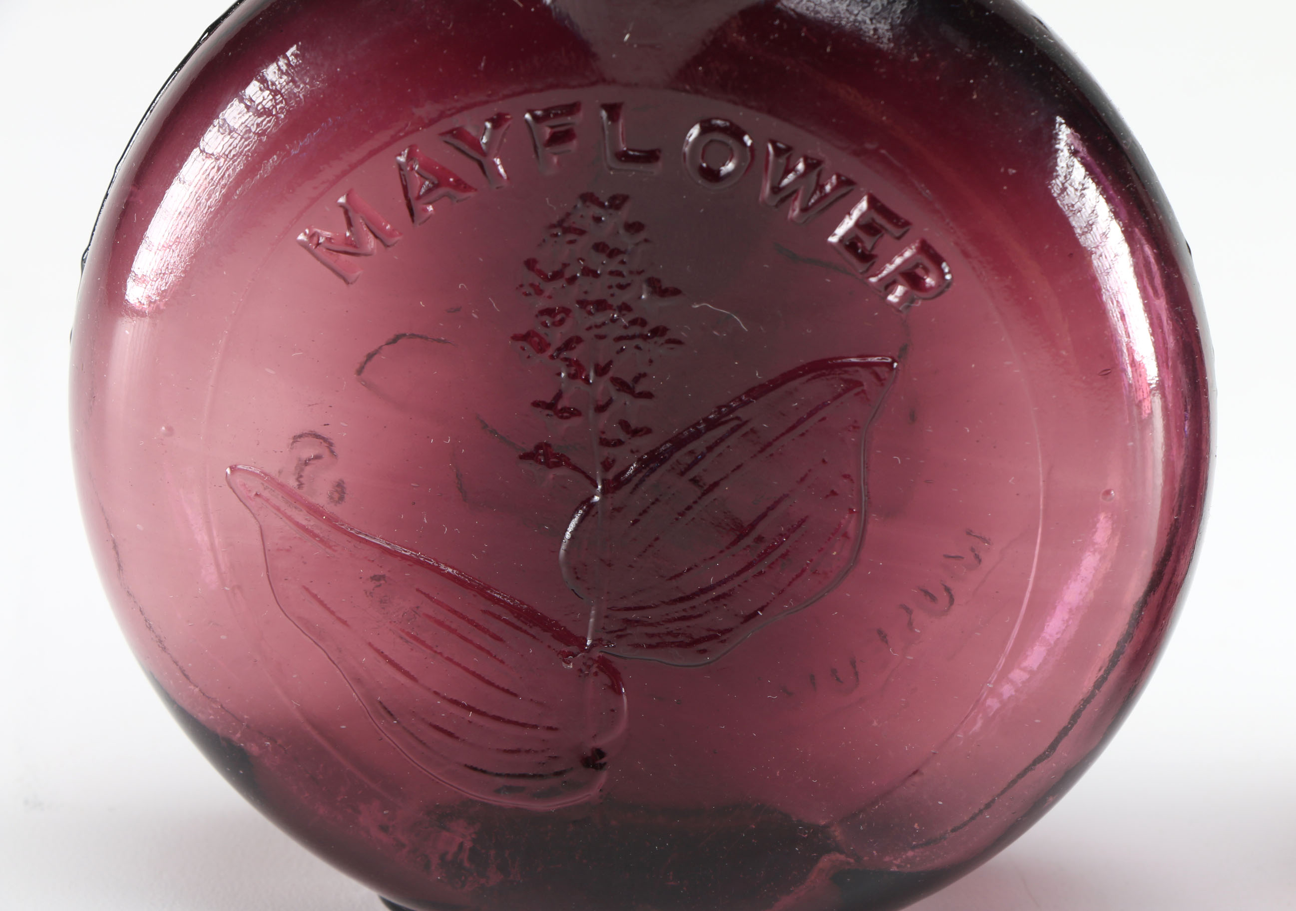 Assortment of Clevenger Brothers Colored Glass Bottles