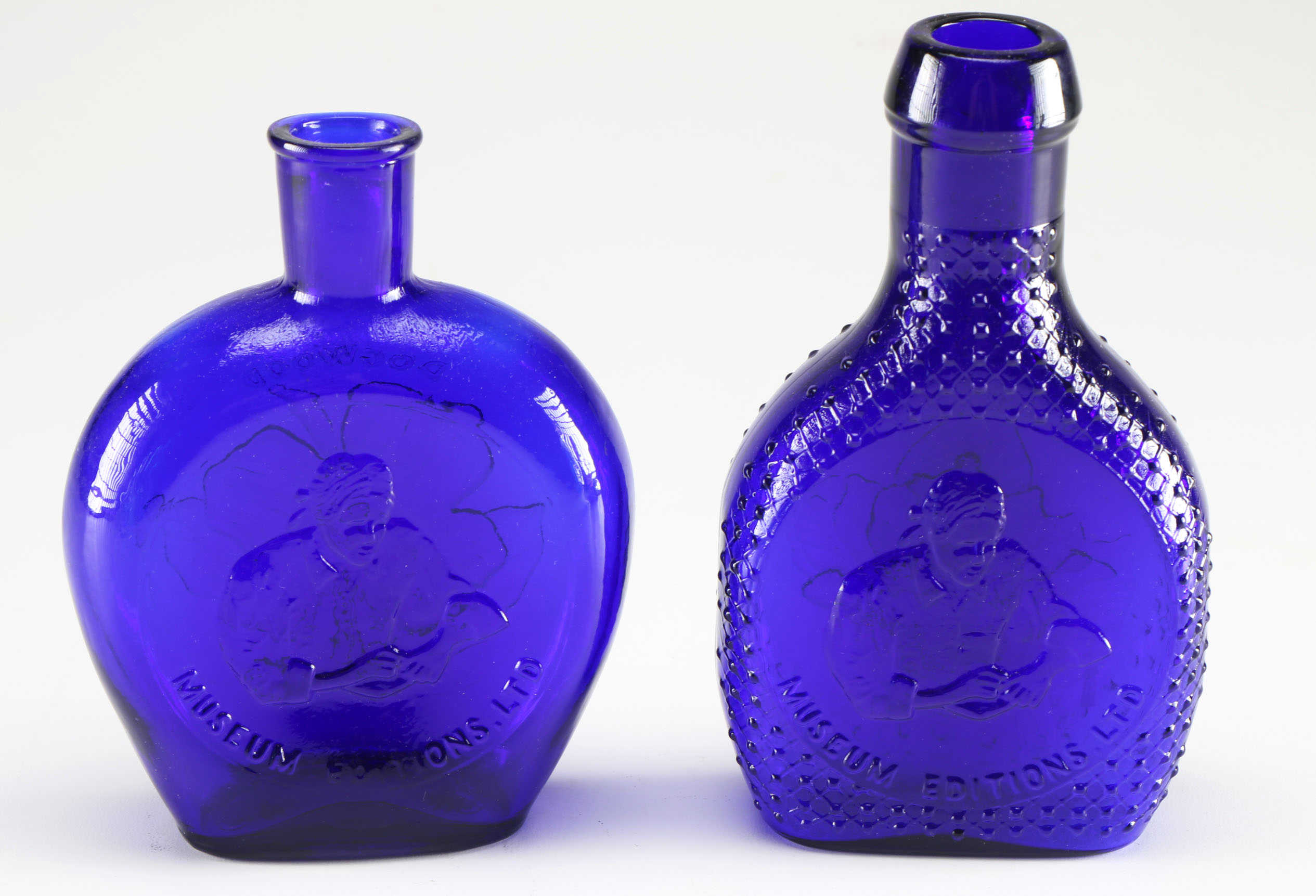 Assortment of Clevenger Brothers Colored Glass Bottles