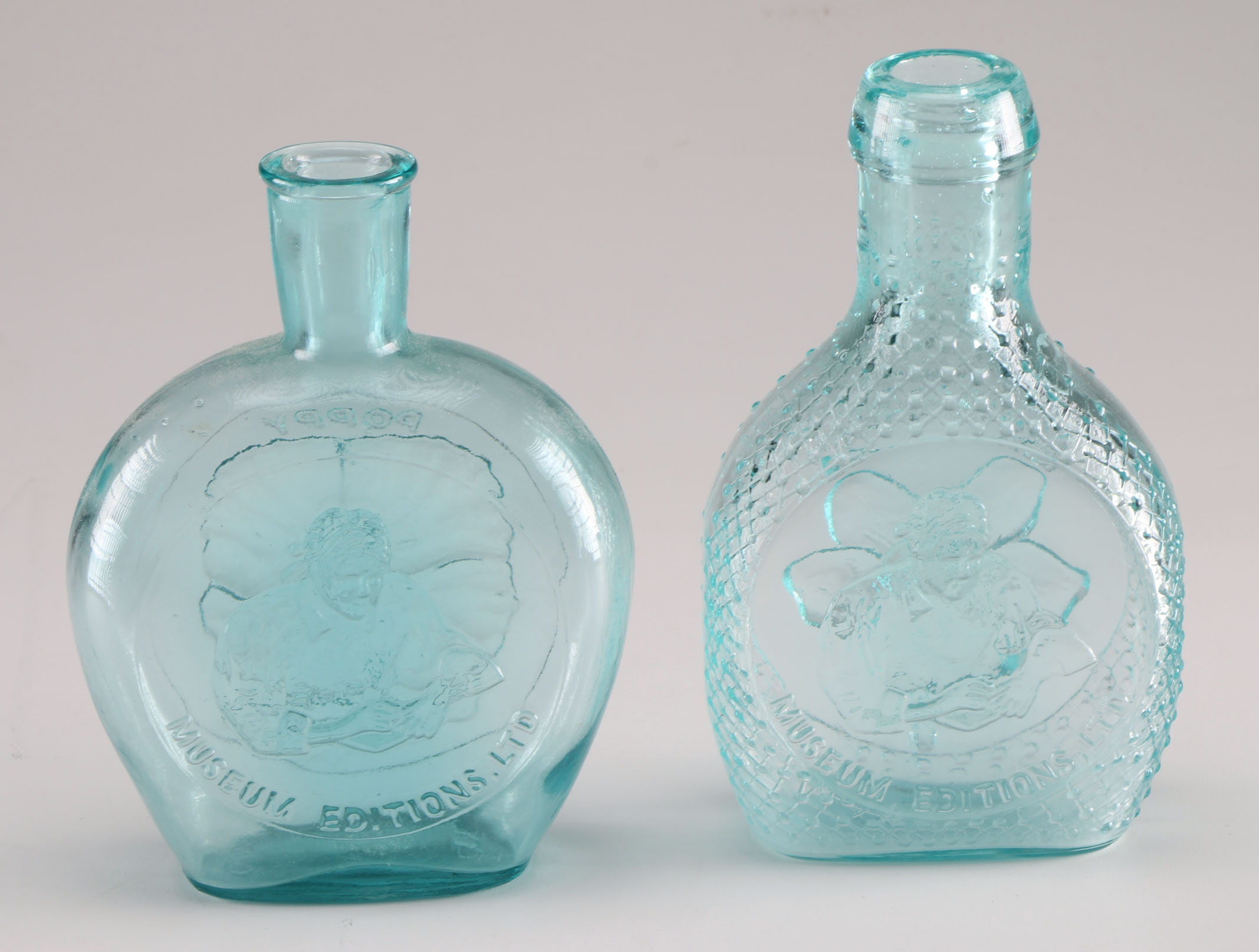 Assortment of Clevenger Brothers Colored Glass Bottles