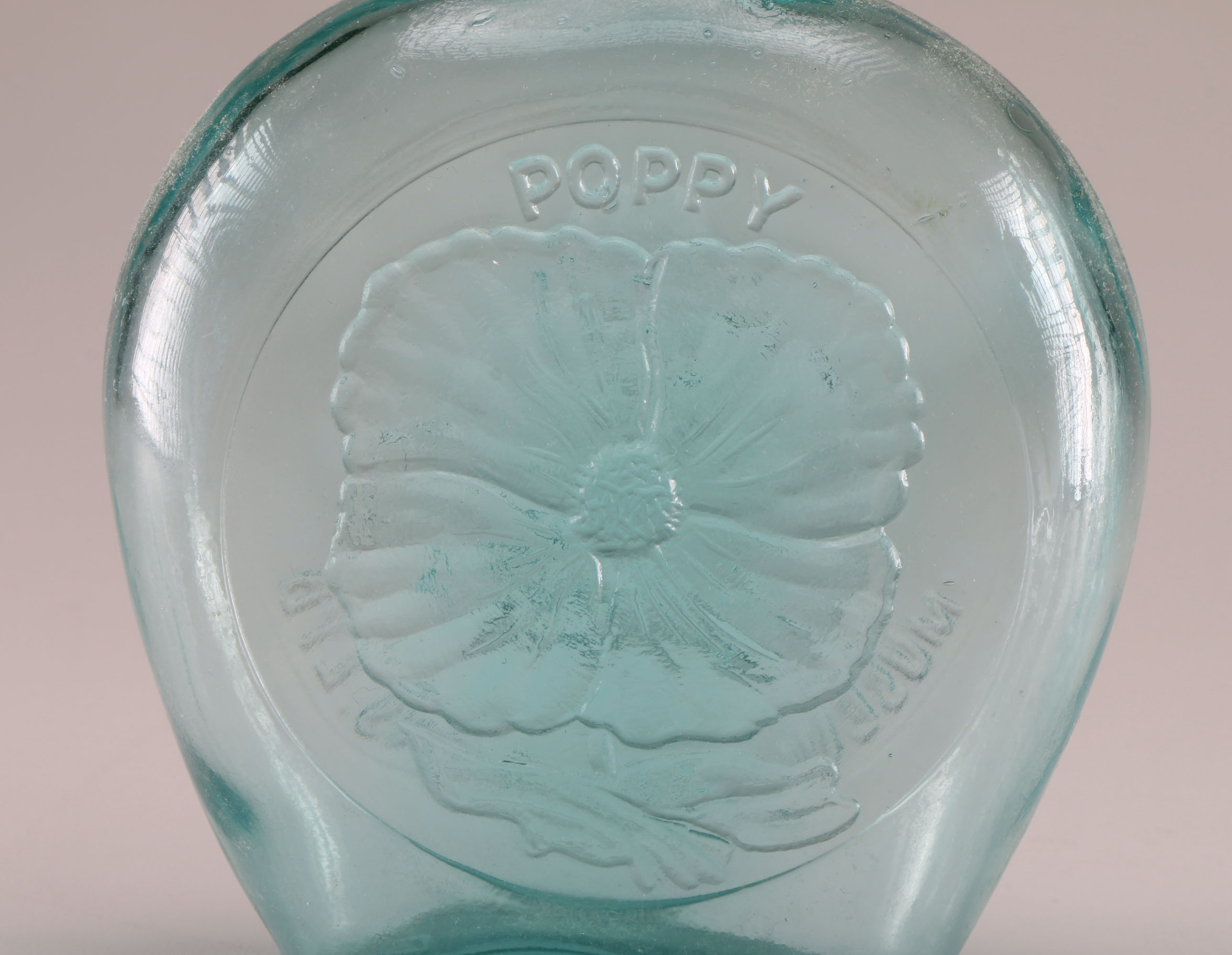 Assortment of Clevenger Brothers Colored Glass Bottles