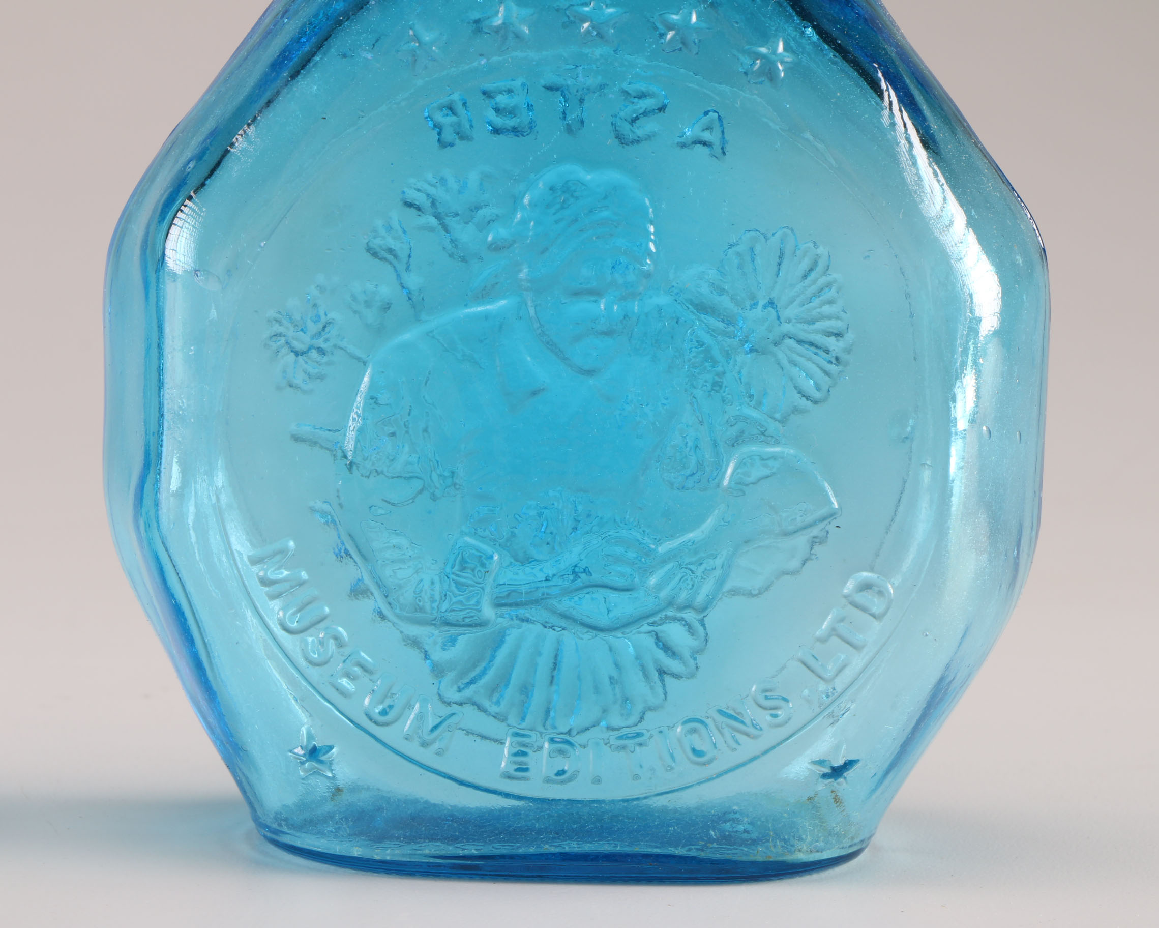 Assortment of Clevenger Brothers Colored Glass Bottles